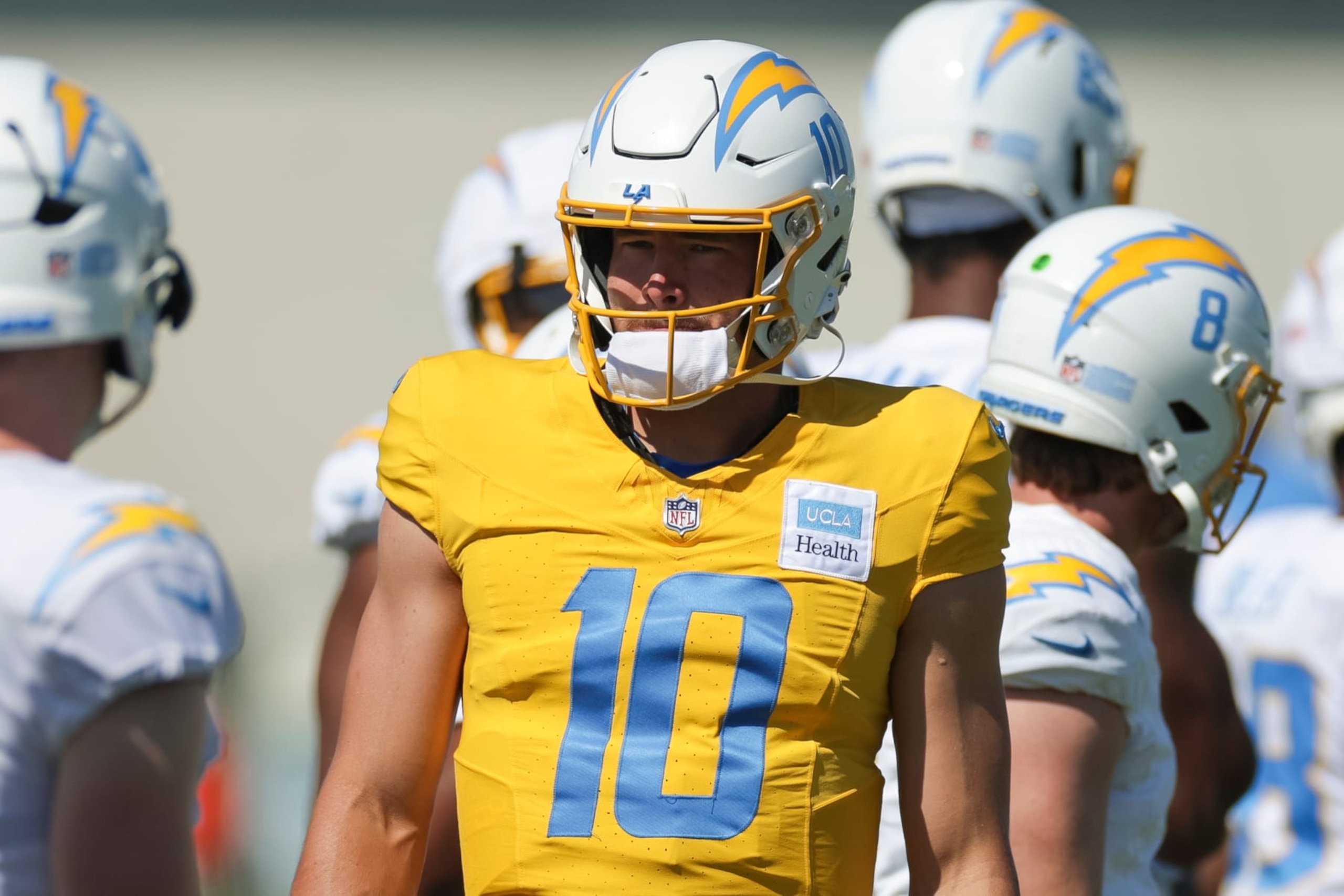 EL SEGUNDO, CA - JULY 29: Los Angeles Chargers quarterback Justin Herbert (10) stands with with teammates during the team's training camp at The Bolt on July 29, 2024 in El Segundo, CA. (Photo by Brandon Sloter/Icon Sportswire via Getty Images)