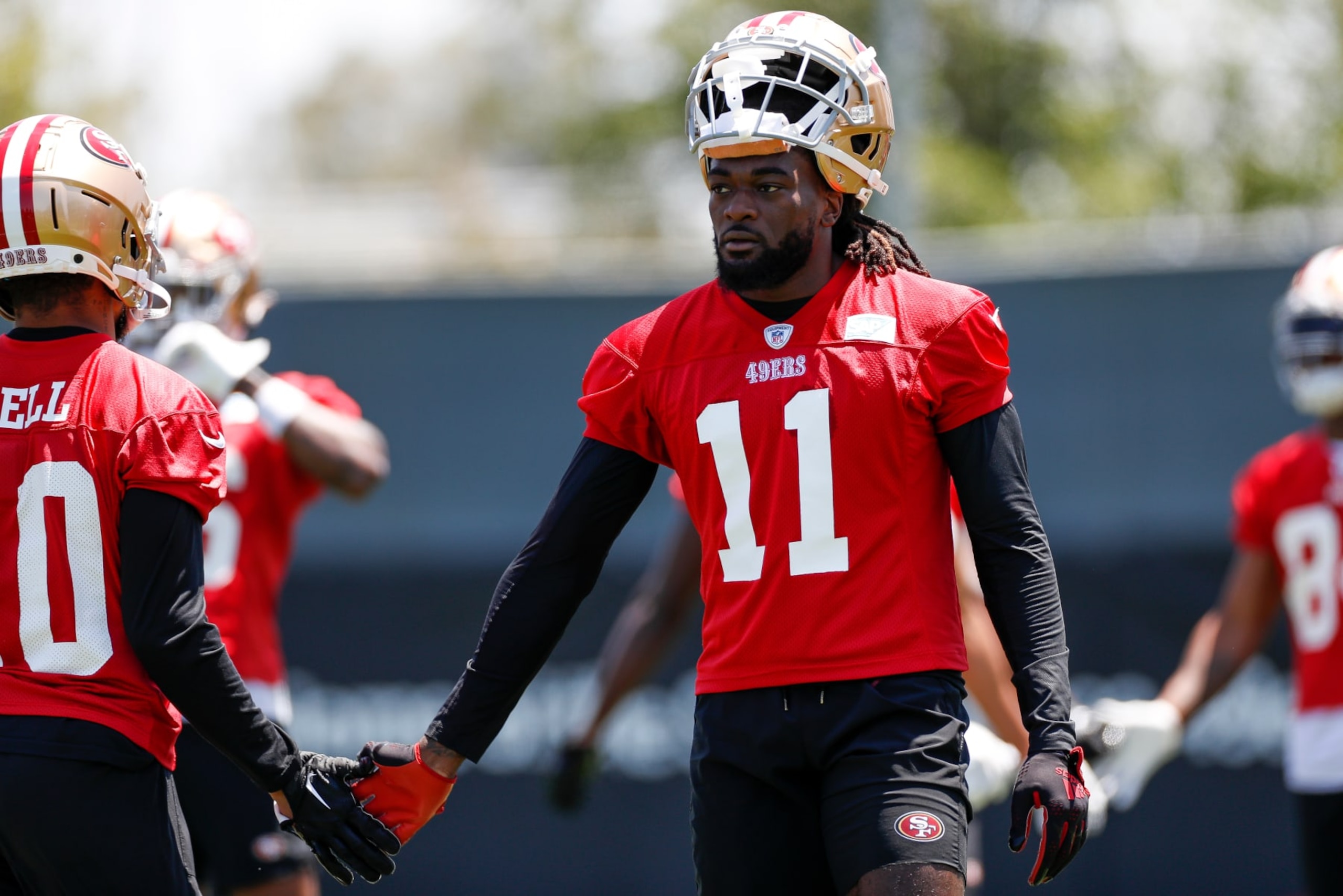 SANTA CLARA, CA - MAY 31: San Francisco 49ers wide receiver Brandon Aiyuk (11) high fives wide receiver Ronnie Bell (10) during the team's OTA practice on May 31, 2023, at the SAP Performance Facility in Santa Clara, CA. (Photo by Brandon Sloter/Icon Sportswire via Getty Images)