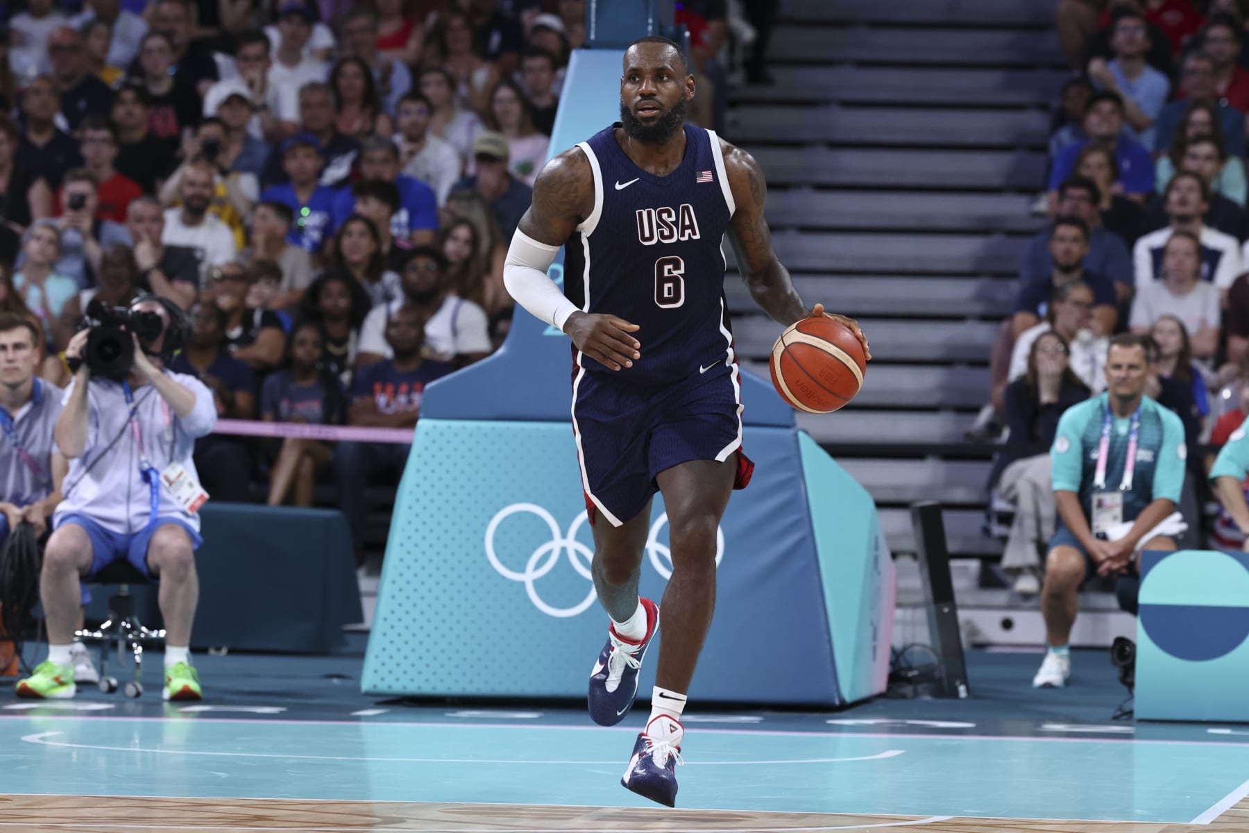 LILLE, FRANCE - JULY 28: LeBron James #6 of Team USA dribbles the ball during the Men's Group Phase - Group C match between Serbia and USA on Day 2 of the Olympic Games Paris 2024 at Stade Pierre Mauroy on July 28, 2024 in Lille, France. (Photo by Catherine Steenkeste/Getty Images)