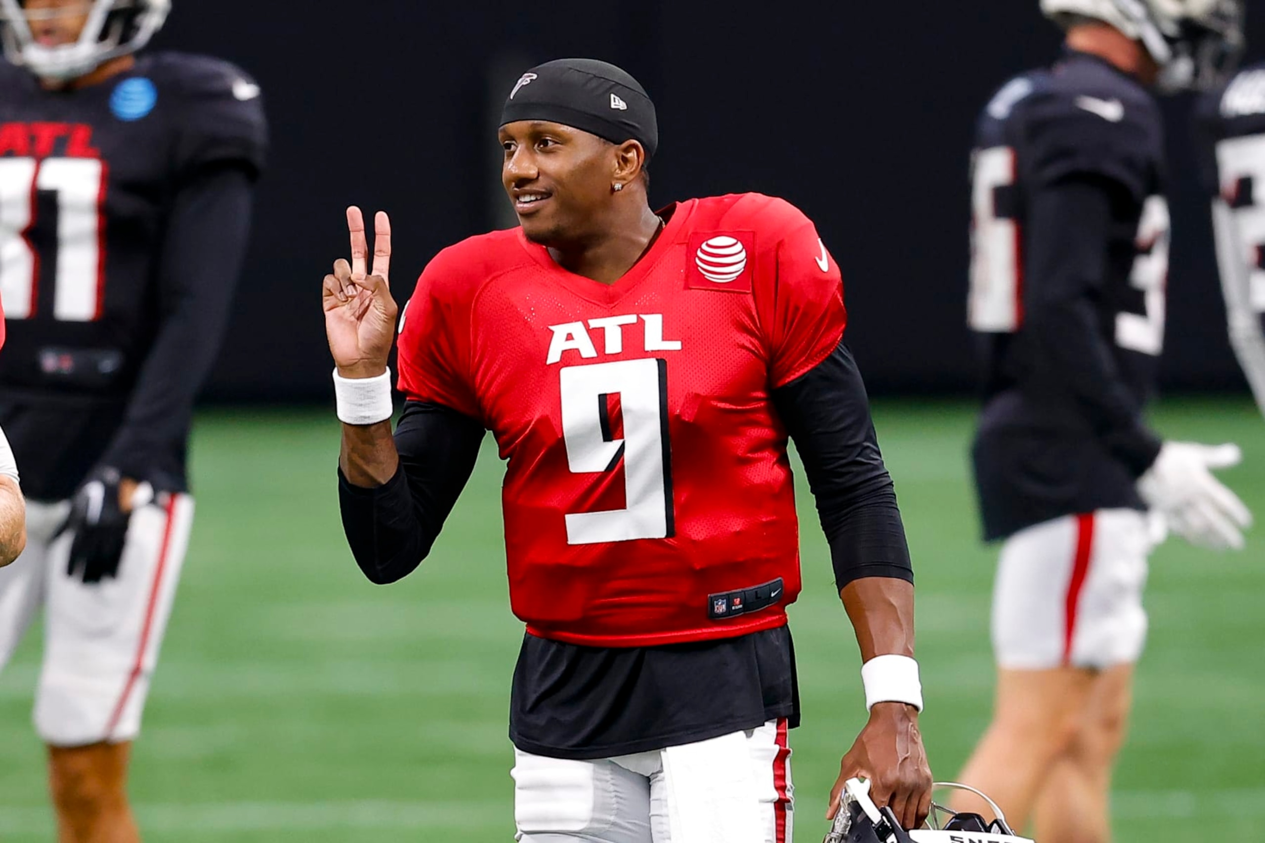 ATLANTA, GEORGIA - AUGUST 2: Michael Penix Jr. #9 of the Atlanta Falcons reacts during NFL training camp at Mercedes-Benz Stadium on August 2, 2024 in Atlanta, Georgia. (Photo by Todd Kirkland/Getty Images)