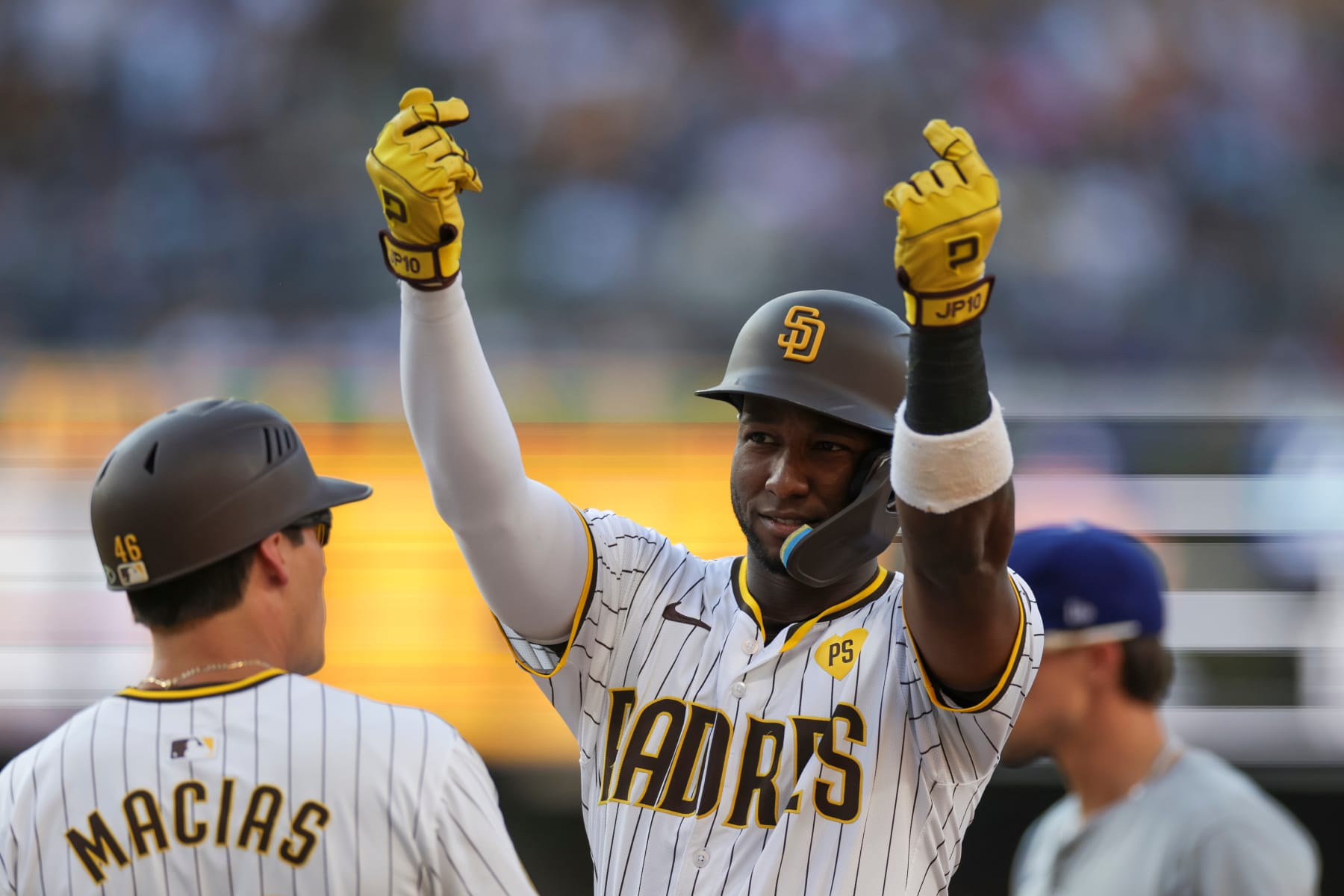 SAN DIEGO, CALIFORNIA - JULY 31: Jurickson Profar #10 of the San Diego Padres celebrates after hitting an RBI single in the second inning during a game against the Los Angeles Dodgers at Petco Park on July 31, 2024 in San Diego, California. (Photo by Brandon Sloter/Getty Images)