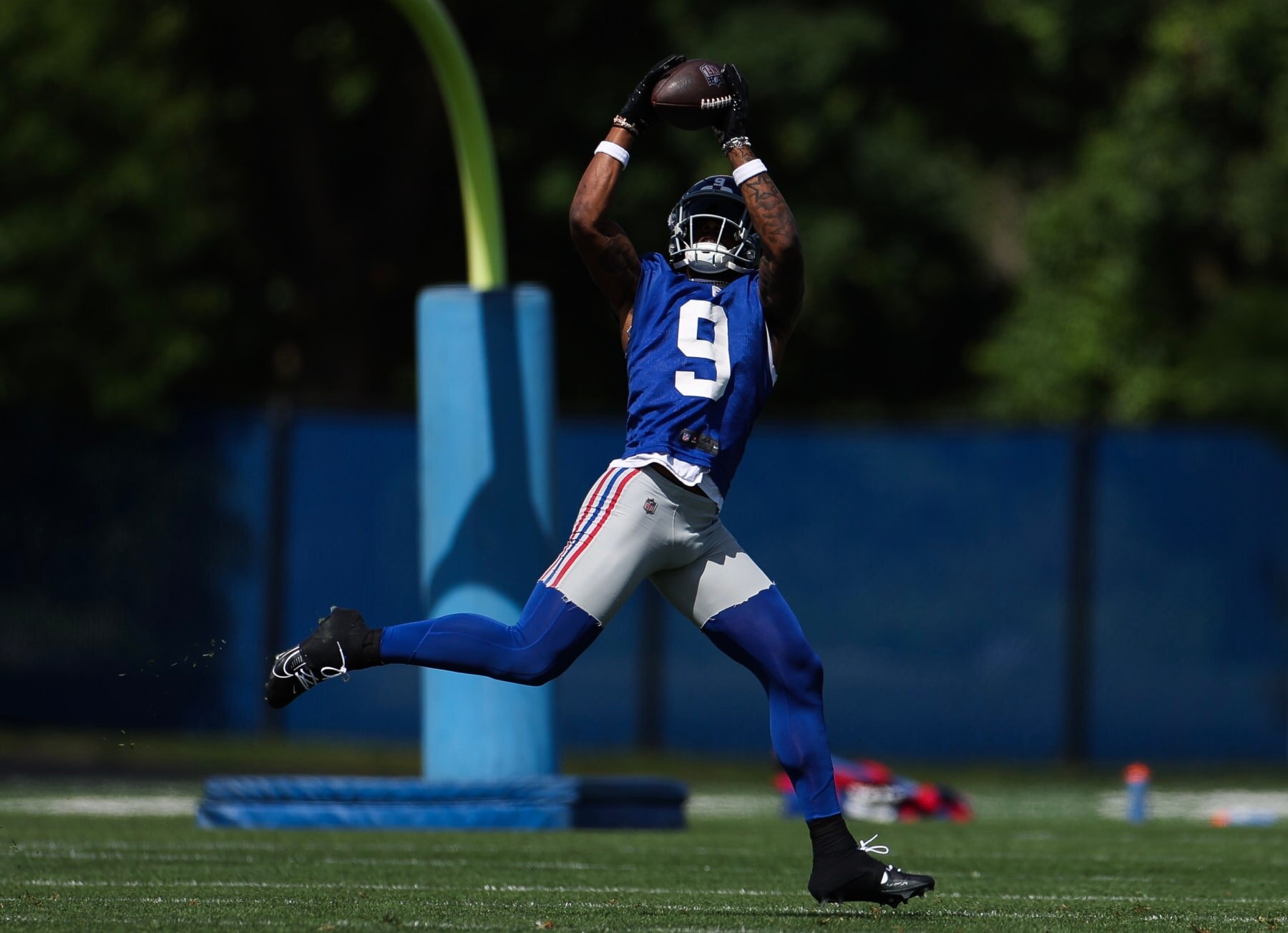 EAST RUTHERFORD, NEW JERSEY - MAY 30: Malik Nabers #9 of the New York Giants makes a catch during OTA Offseason Workouts at NY Giants Quest Diagnostics Training Center on May 30, 2024 in East Rutherford, New Jersey. (Photo by Luke Hales/Getty Images)