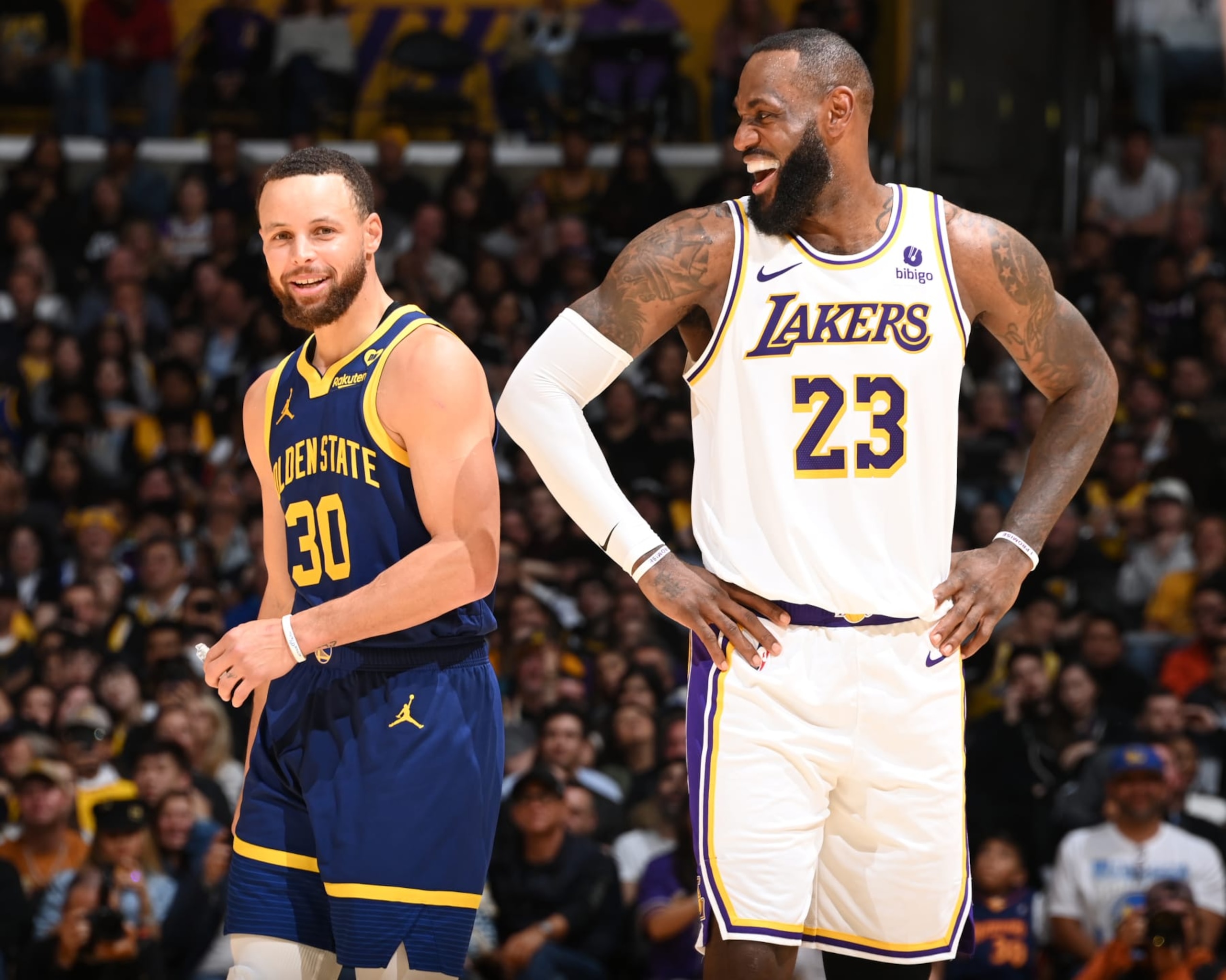 LOS ANGELES, CA - MARCH 16:  LeBron James #23 of the Los Angeles Lakers & Stephen Curry #30 of the Golden State Warriors looks on during the game on March 16, 2024 at Crypto.Com Arena in Los Angeles, California. NOTE TO USER: User expressly acknowledges and agrees that, by downloading and/or using this Photograph, user is consenting to the terms and conditions of the Getty Images License Agreement. Mandatory Copyright Notice: Copyright 2024 NBAE (Photo by Andrew D. Bernstein/NBAE via Getty Images)