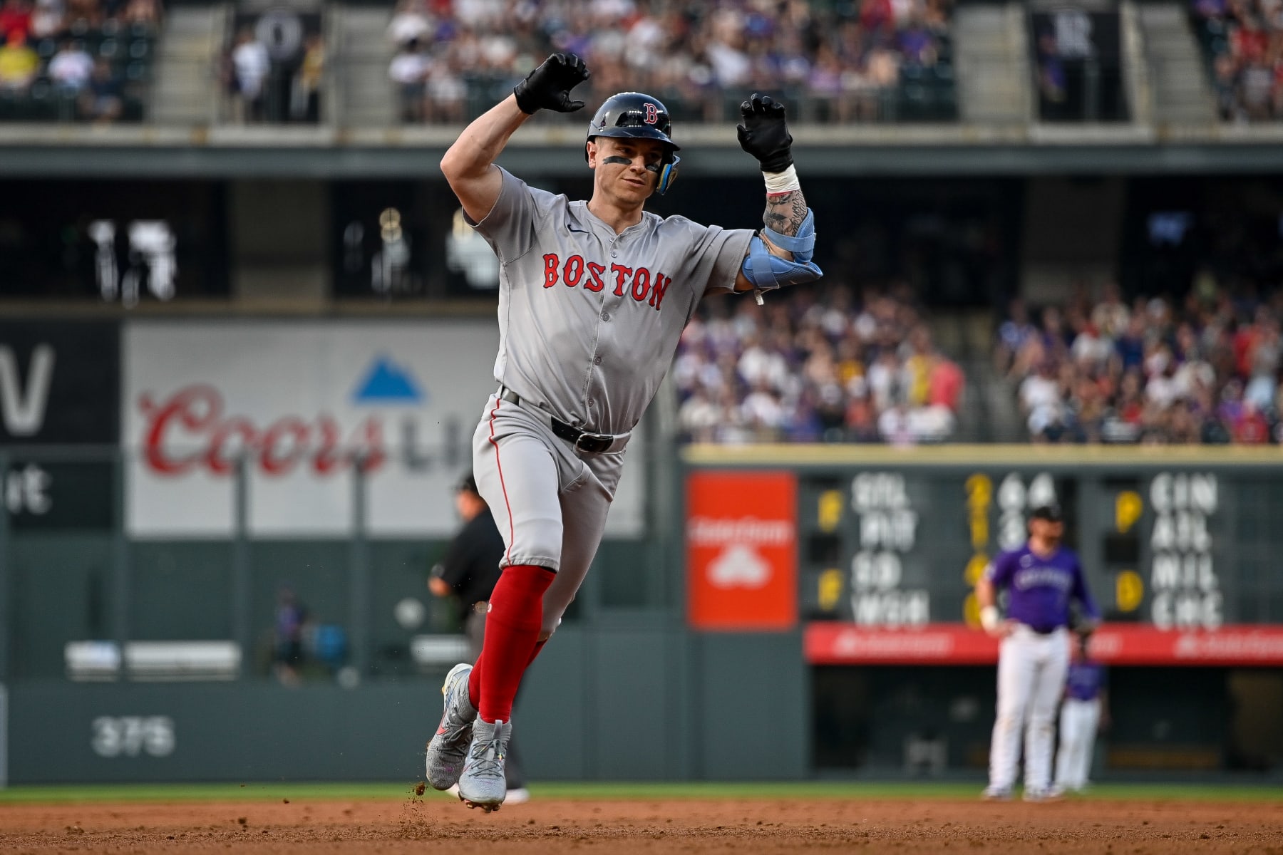 DENVER, CO - JULY 23: Boston Red Sox left fielder Tyler O'Neill (17) celebrates his third inning solo home run as he runs the bases during a game between the Boston Red Sox and the Colorado Rockies at Coors Field on July 23, 2024 in Denver, Colorado. (Photo by Dustin Bradford/Icon Sportswire via Getty Images)