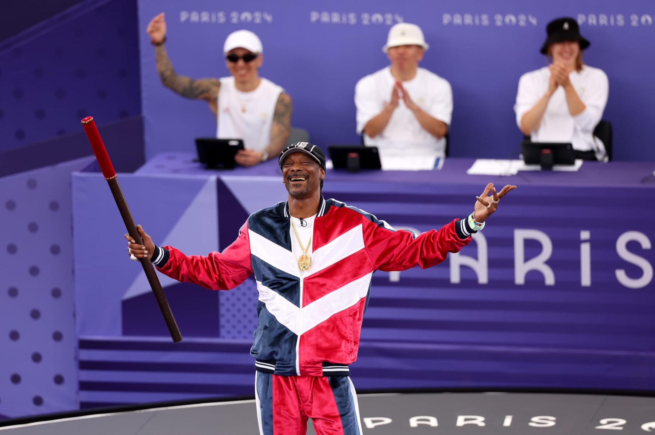 PARIS, FRANCE - AUGUST 09: Snoop Dogg, performs the Coup de Baton ceremony prior to the Breaking Competition on day fourteen of the Olympic Games Paris 2024 at Place de la Concorde on August 09, 2024 in Paris, France. (Photo by Ezra Shaw/Getty Images)