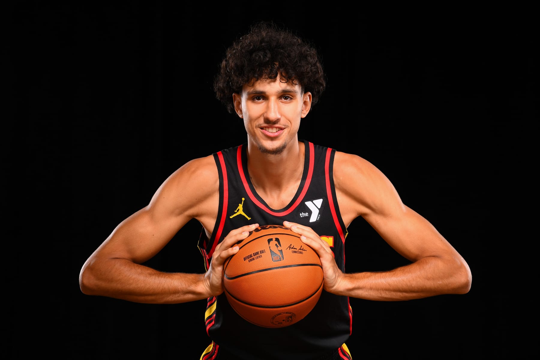 LAS VEGAS, NV - JULY 16: Zaccharie Risacher #10 of the Atlanta Hawks poses for a portrait during the 2024 NBA Rookie Photo Shoot on July 16, 2024 at the University of Nevada, Las Vegas campus in Las Vegas, Nevada. NOTE TO USER: User expressly acknowledges and agrees that, by downloading and/or using this Photograph, user is consenting to the terms and conditions of the Getty Images License Agreement. Mandatory Copyright Notice: Copyright 2024 NBAE (Photo by Brian Babineau/NBAE via Getty Images)