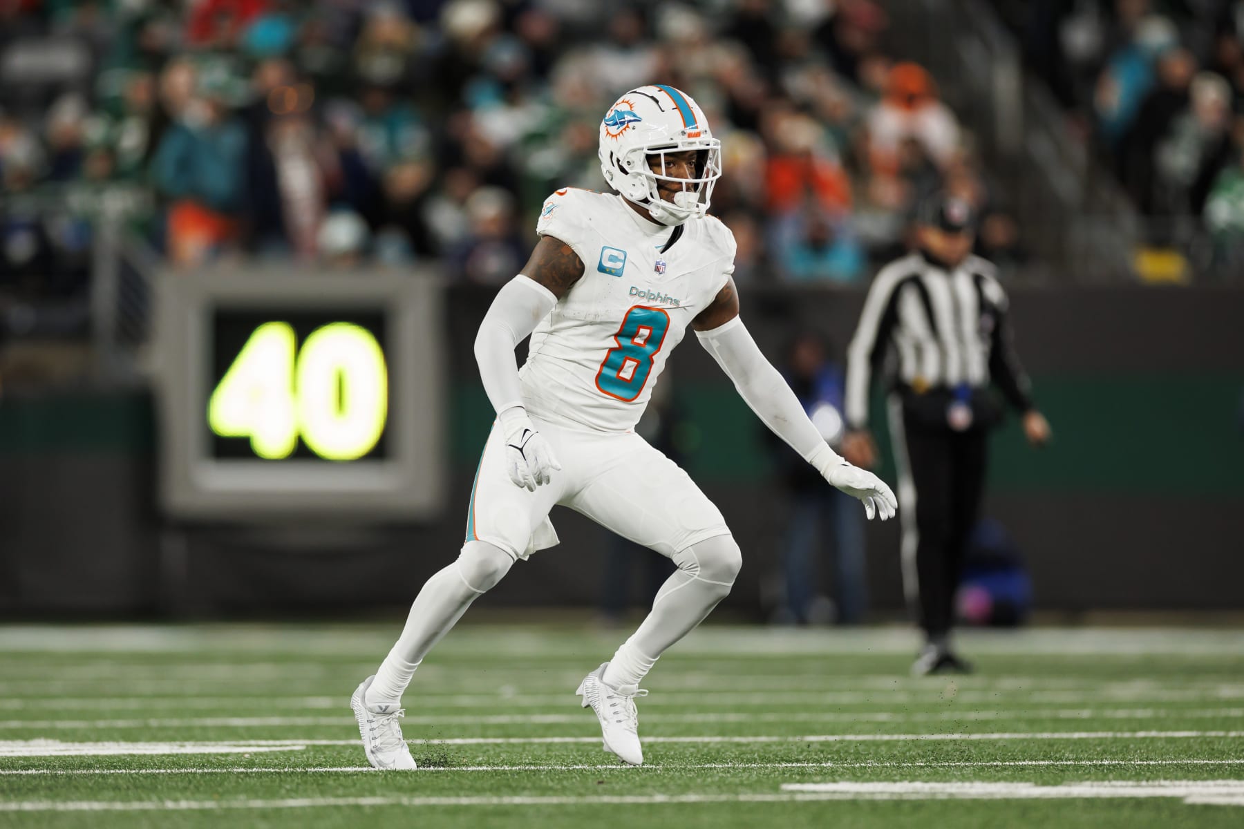 EAST RUTHERFORD, NEW JERSEY - NOVEMBER 24: Jevon Holland #8 of the Miami Dolphins defends in coverage during an NFL football game against the New York Jets at MetLife Stadium on November 24, 2023 in East Rutherford, New Jersey. (Photo by Ryan Kang/Getty Images)