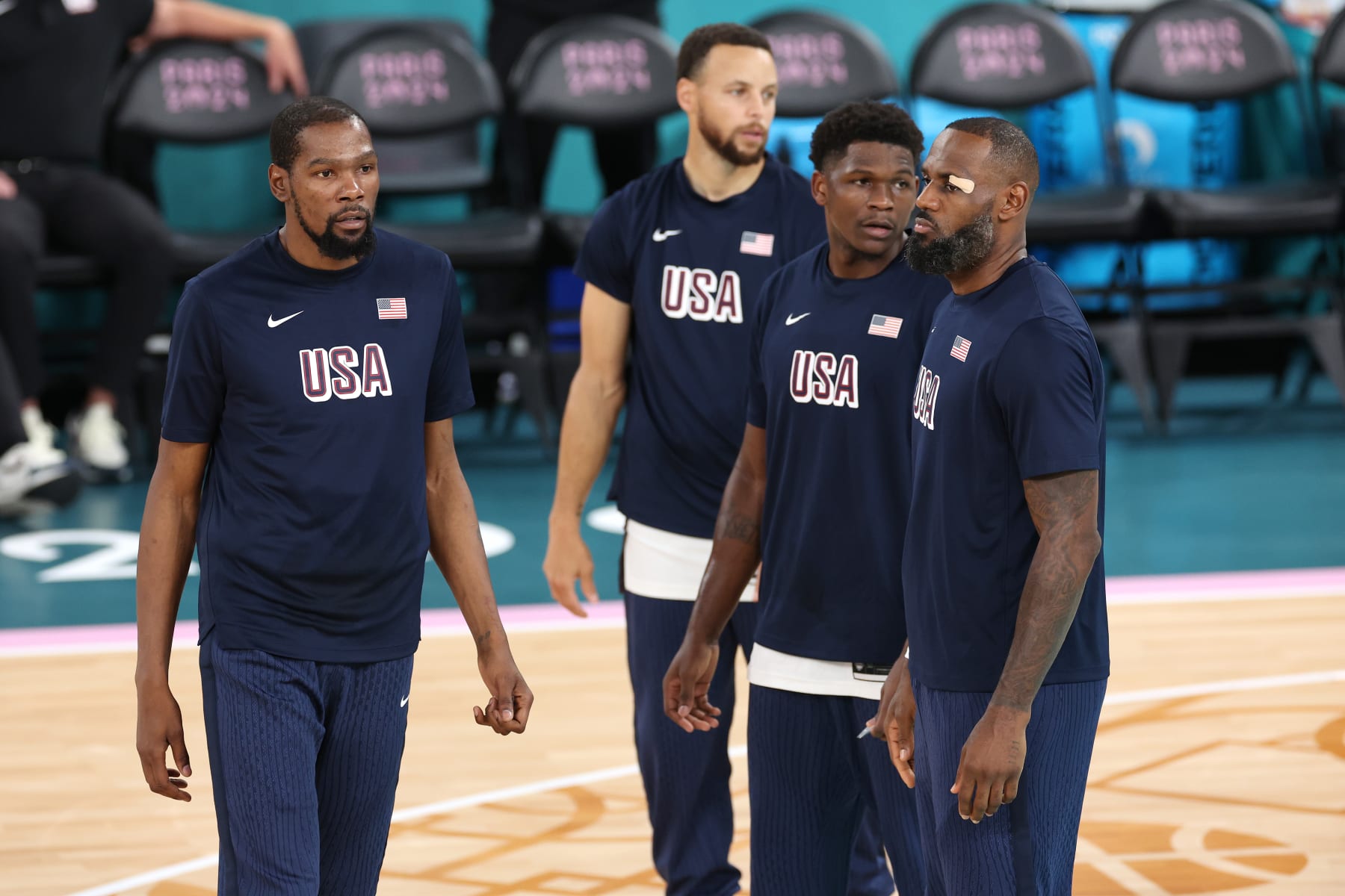 PARIS, FRANCE - AUGUST 08: Kevin Durant, Stephen Curry, Anthony Edwards, and Lebron James of Team United States look on prior to a Men's basketball semifinals match between Team United States and Team Serbia on day thirteen of the Olympic Games Paris 2024 at Bercy Arena on August 08, 2024 in Paris, France. (Photo by Sarah Stier/Getty Images)