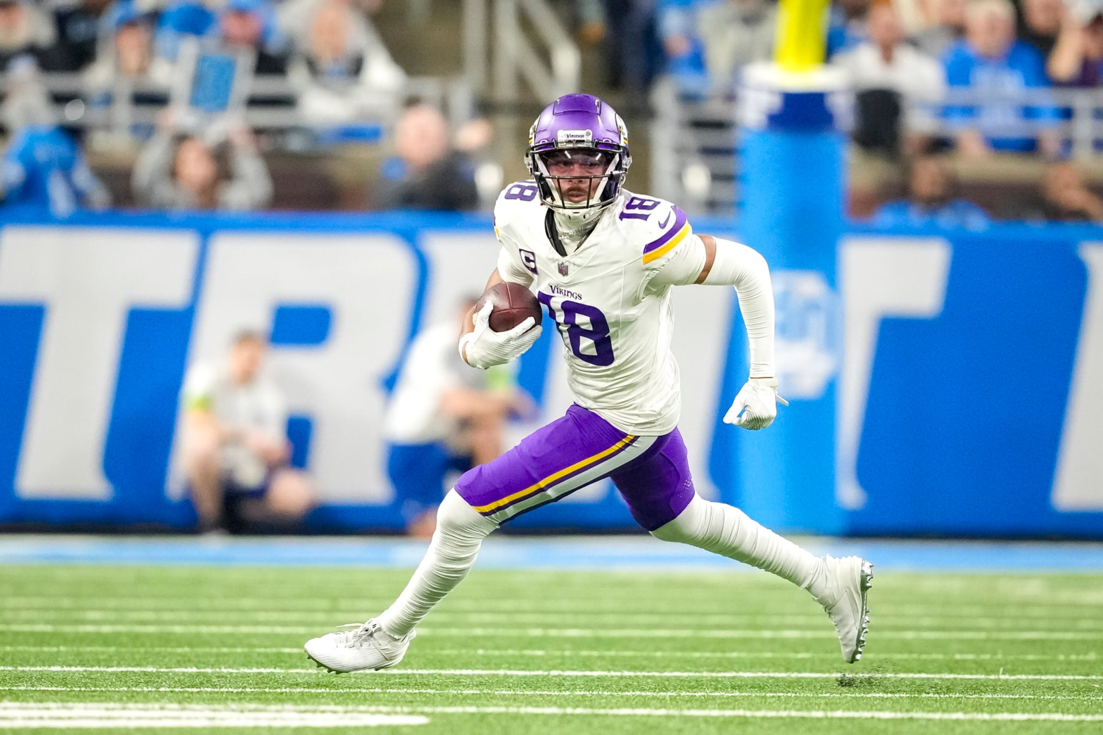 DETROIT, MICHIGAN - JANUARY 07: Justin Jefferson #18 of the Minnesota Vikings runs the ball against the Detroit Lions at Ford Field on January 07, 2024 in Detroit, Michigan. (Photo by Nic Antaya/Getty Images)