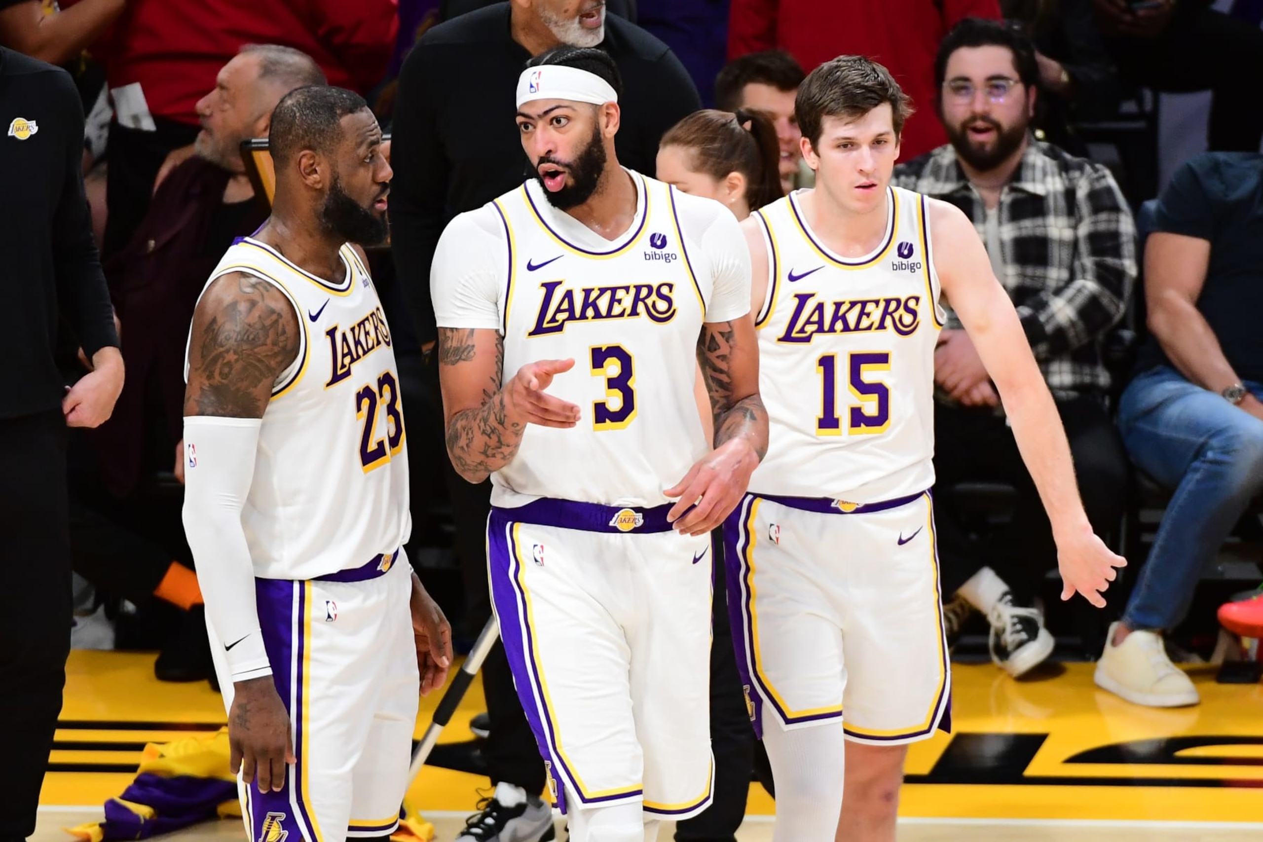 LOS ANGELES, CA - JANUARY 7: LeBron James  #23. Austin Reaves #15 and Anthony Davis #3 of the Los Angeles Lakers looks on during the game against the LA Clippers on January 7, 2024 at Crypto.Com Arena in Los Angeles, California. NOTE TO USER: User expressly acknowledges and agrees that, by downloading and/or using this Photograph, user is consenting to the terms and conditions of the Getty Images License Agreement. Mandatory Copyright Notice: Copyright 2024 NBAE (Photo by Adam Pantozzi/NBAE via Getty Images)