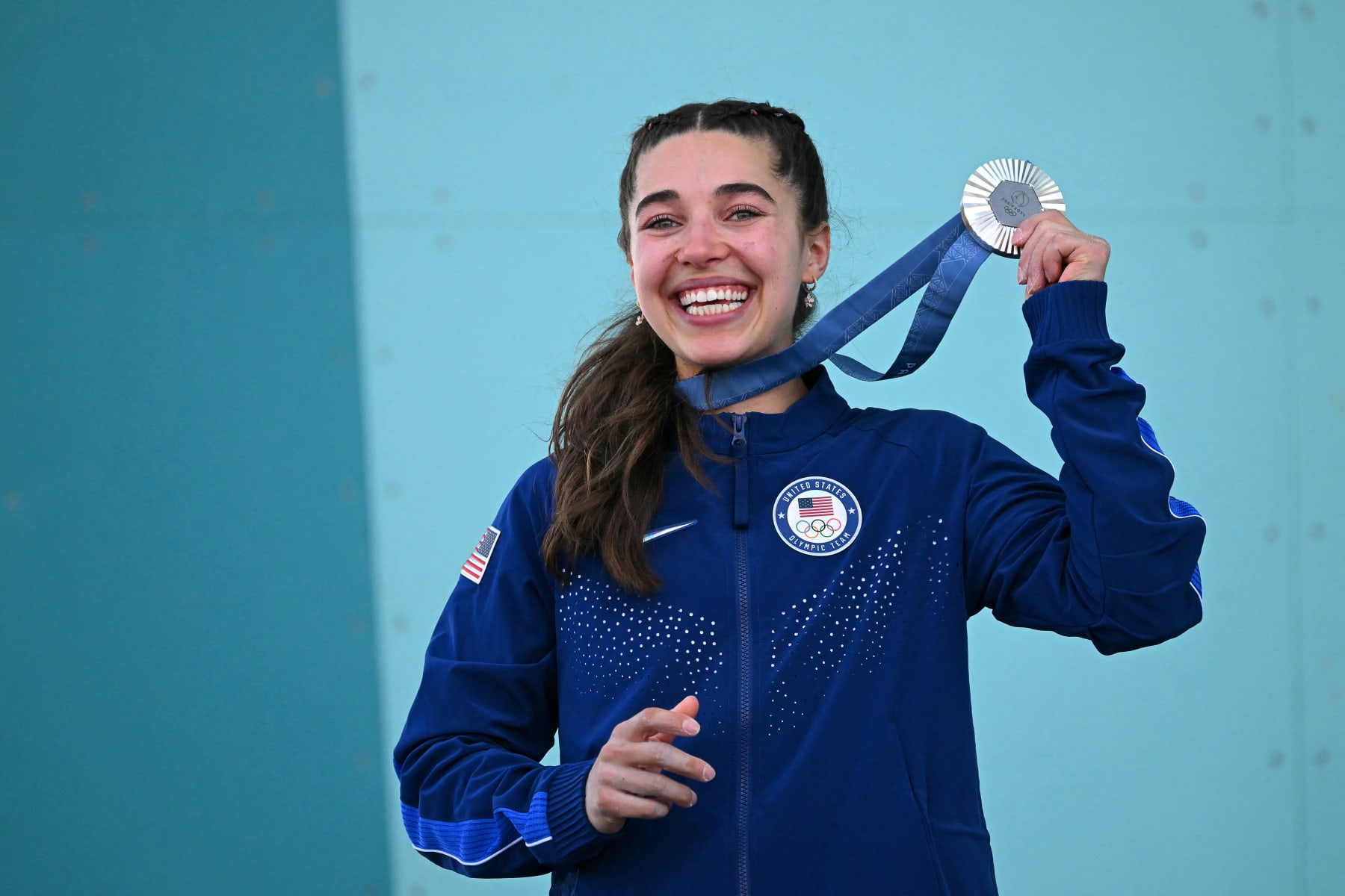 Silver medallist US' Brooke Raboutou poses on the podium of the women's sport climbing boulder and lead event during the Paris 2024 Olympic Games at Le Bourget Sport Climbing Venue in Le Bourget on August 10, 2024. (Photo by Fabrice COFFRINI / AFP) (Photo by FABRICE COFFRINI/AFP via Getty Images)