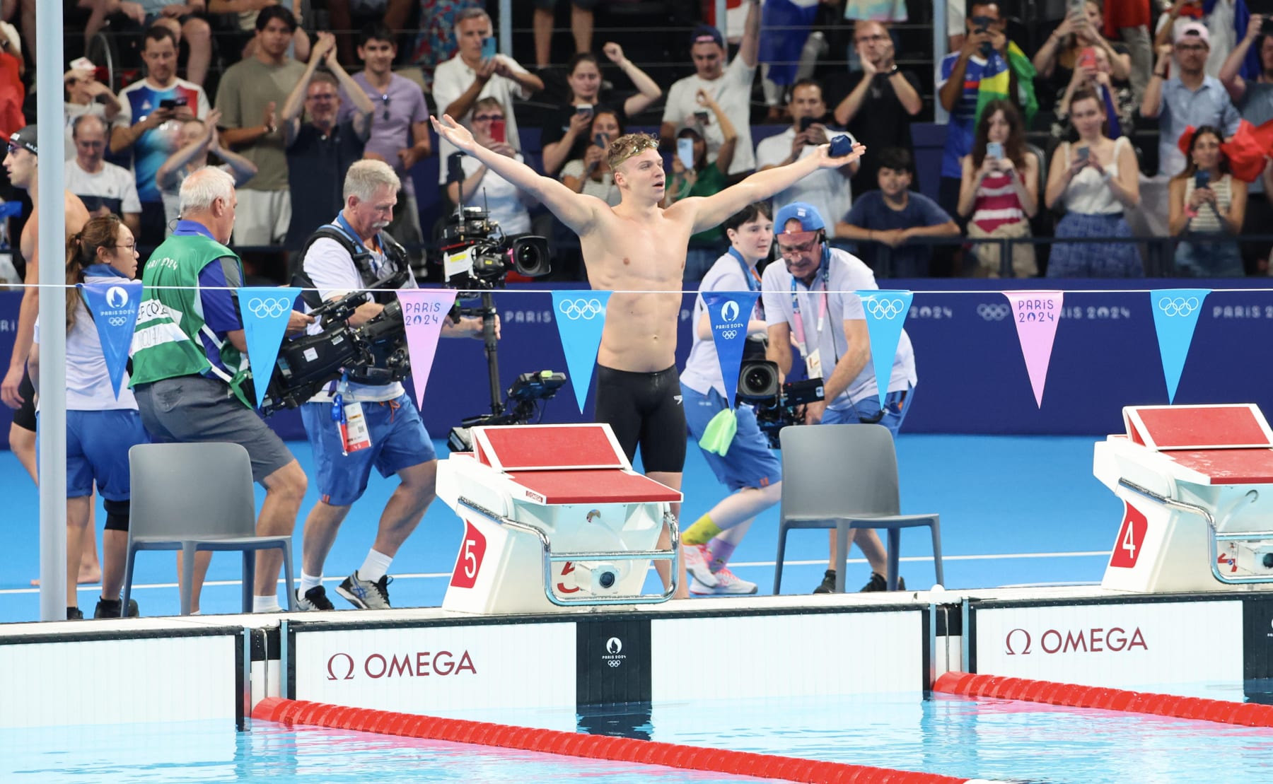 NANTERRE, FRANCE - AUGUST 02: Leon Marchand of Team France reacts after winning gold in the Men's 200m Individual Medley Final on day seven of the Olympic Games Paris 2024 at Paris La Defense Arena on August 02, 2024 in Nanterre, France (Photo by Xavier Laine/Getty Images)