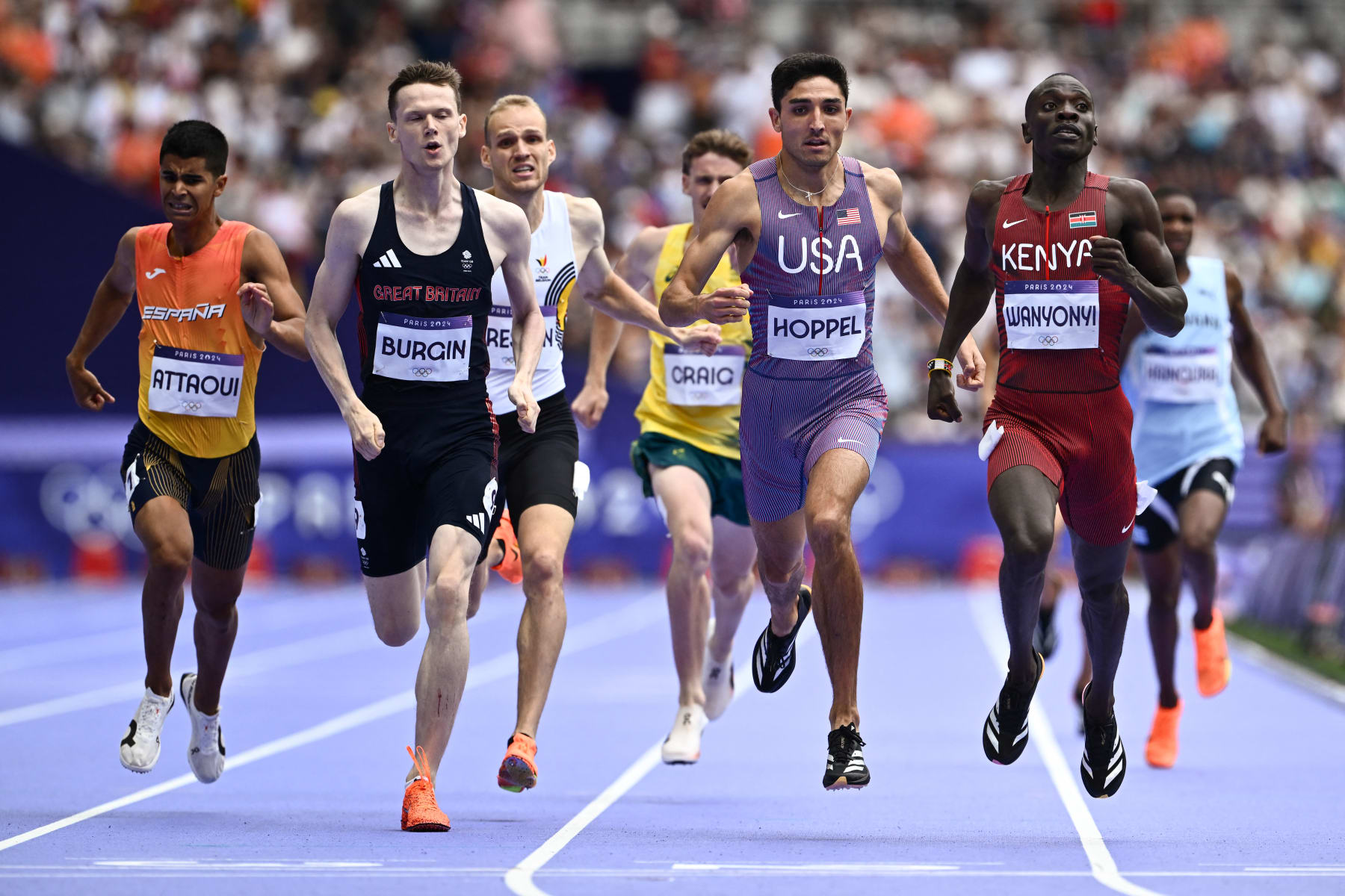 Spain's Mohamed Attaoui, Britain's Max Burgin, Australia's Peyton Craig, US' Bryce Hoppel and Kenya's Emmanuel Wanyonyi compete in the men's 800m semi-final of the athletics event at the Paris 2024 Olympic Games at Stade de France in Saint-Denis, north of Paris, on August 9, 2024. (Photo by Jewel SAMAD / AFP) (Photo by JEWEL SAMAD/AFP via Getty Images)