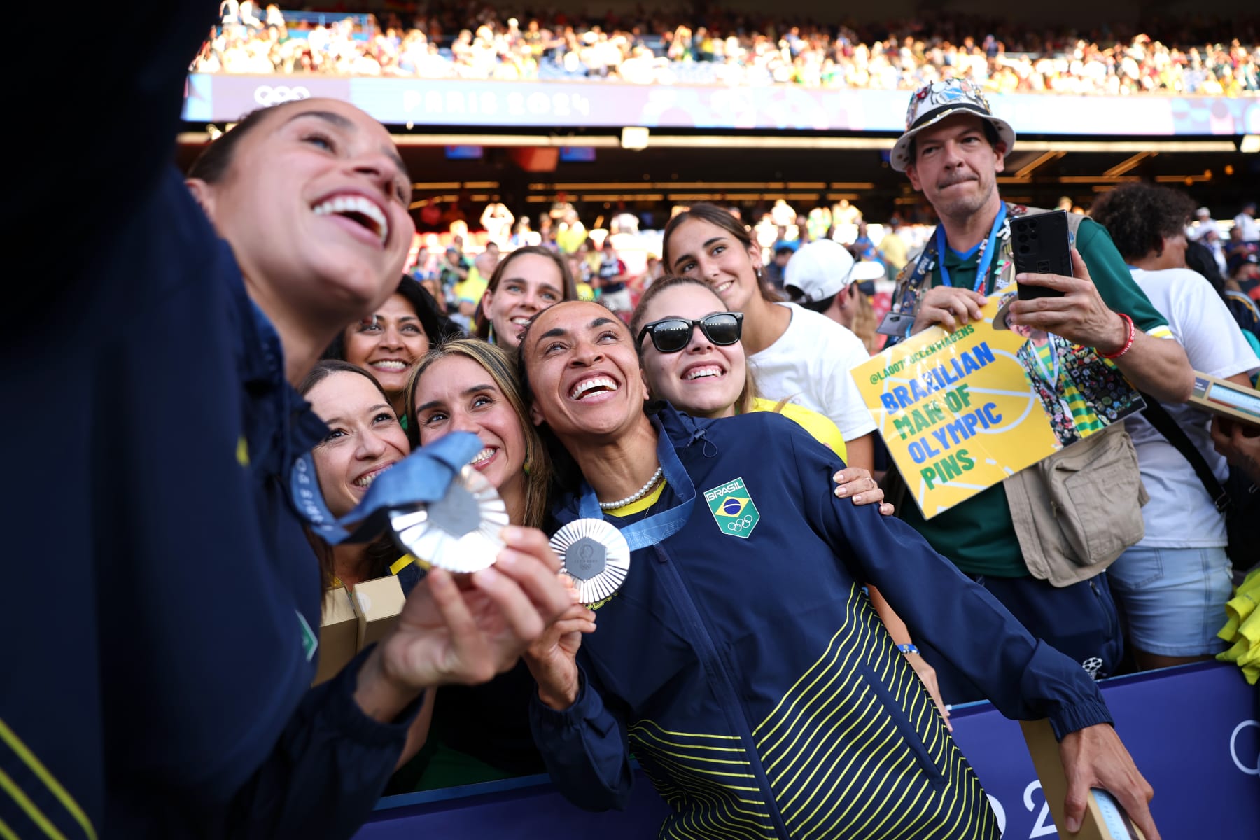 PARIS, FRANCE - AUGUST 10: Silver medalist Marta #10 of Team Brazil celebrates with fans after the Women's Football medal ceremony following the Women's Gold Medal match between Brazil and United States of America during the Olympic Games Paris 2024 at Parc des Princes on August 10, 2024 in Paris, France. (Photo by Robert Cianflone/Getty Images)