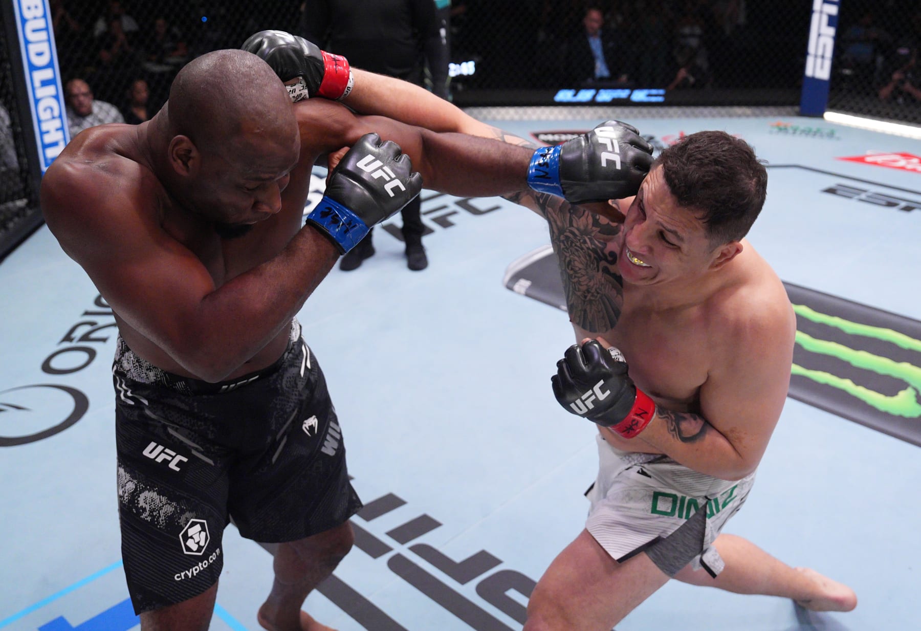 LAS VEGAS, NEVADA - AUGUST 10: (R-L) Jhonata Diniz of Brazil punches Karl Williams of the U.S. Virgin Islands in a heavyweight fight during the UFC Fight Night event at UFC APEX on August 10, 2024 in Las Vegas, Nevada. (Photo by Al Powers/Zuffa LLC)