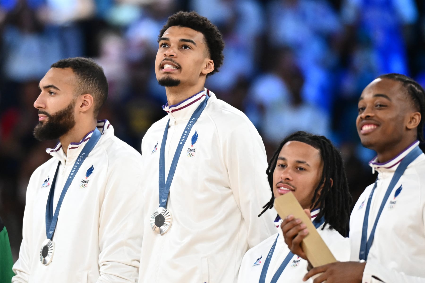 Siver medallists (From L) France's #27 Rudy Gobert, France's #32 Victor Wembanyama, France's #85 Matthew Strazel and France's #99 Bilal Coulibaly pose on the podium after the men's Gold Medal basketball match between France and USA during the Paris 2024 Olympic Games at the Bercy  Arena in Paris on August 10, 2024. (Photo by Aris MESSINIS / AFP) (Photo by ARIS MESSINIS/AFP via Getty Images)