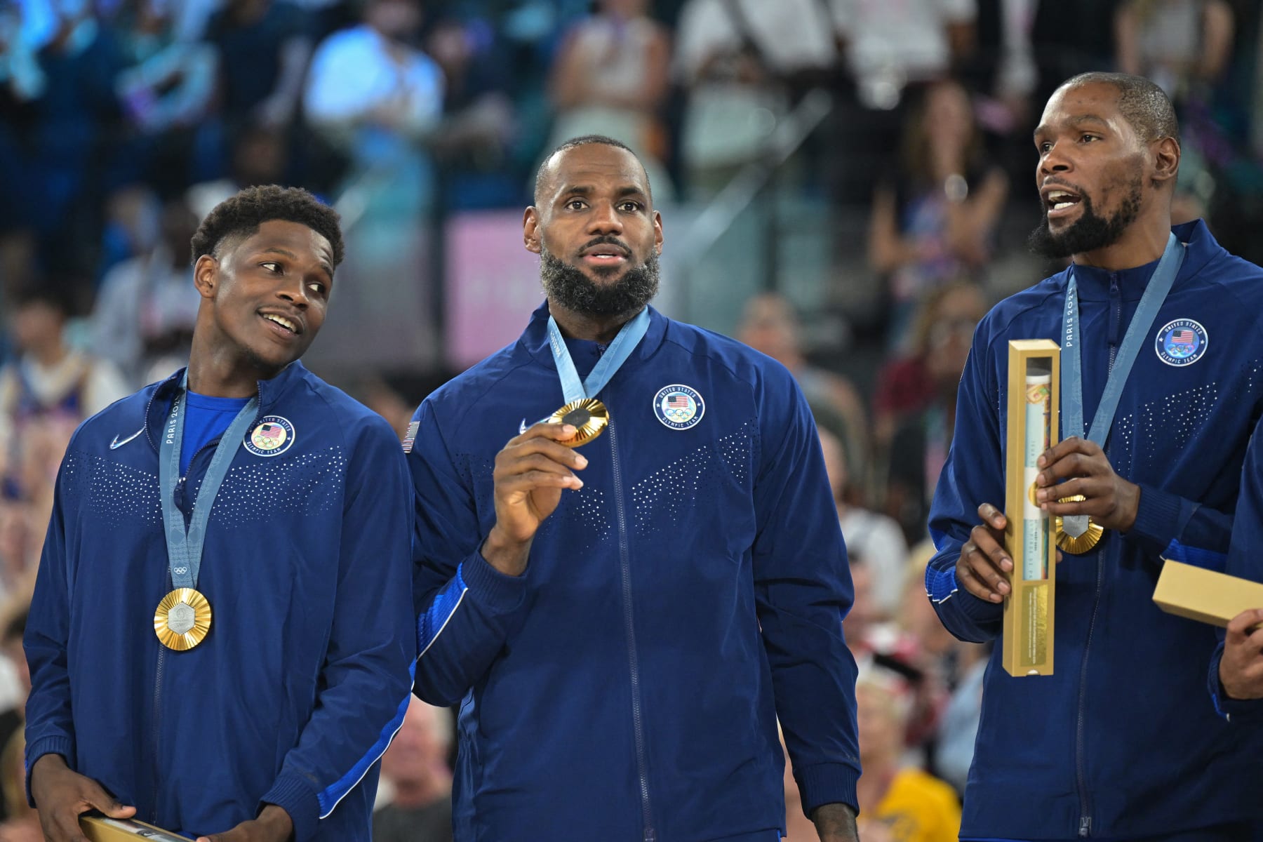 Gold medallists (From L) USA's #05 Anthony Edwards, USA's #06 LeBron James and USA's #07 Kevin Durant pose on the podium after the men's Gold Medal basketball match between France and USA during the Paris 2024 Olympic Games at the Bercy  Arena in Paris on August 10, 2024. (Photo by Damien MEYER / AFP) (Photo by DAMIEN MEYER/AFP via Getty Images)