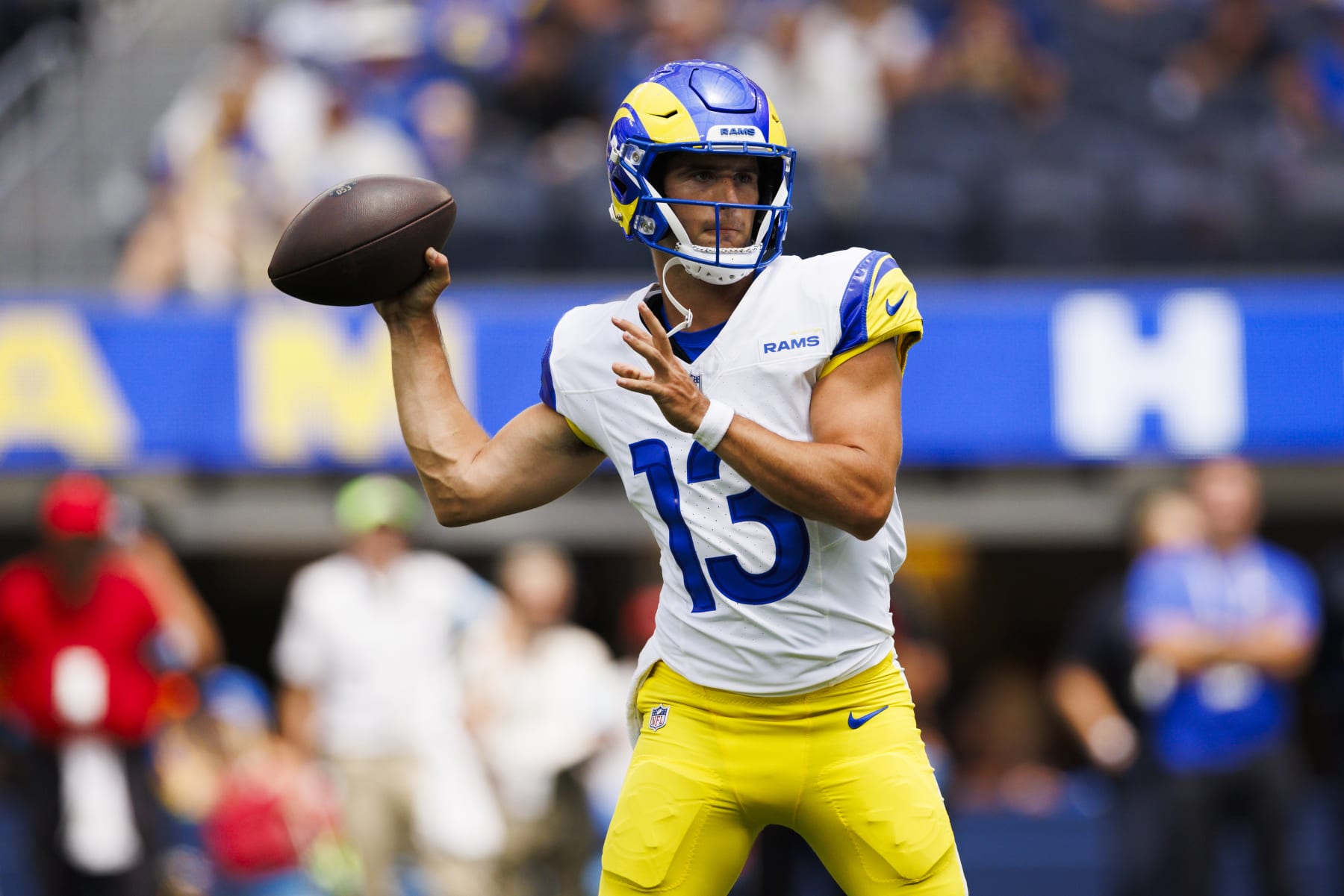 INGLEWOOD, CALIFORNIA - AUGUST 11: Stetson Bennett #13 of the Los Angeles Rams throws during a preseason game against the Dallas Cowboys at SoFi Stadium on August 11, 2024 in Inglewood, California. (Photo by Ric Tapia/Getty Images)