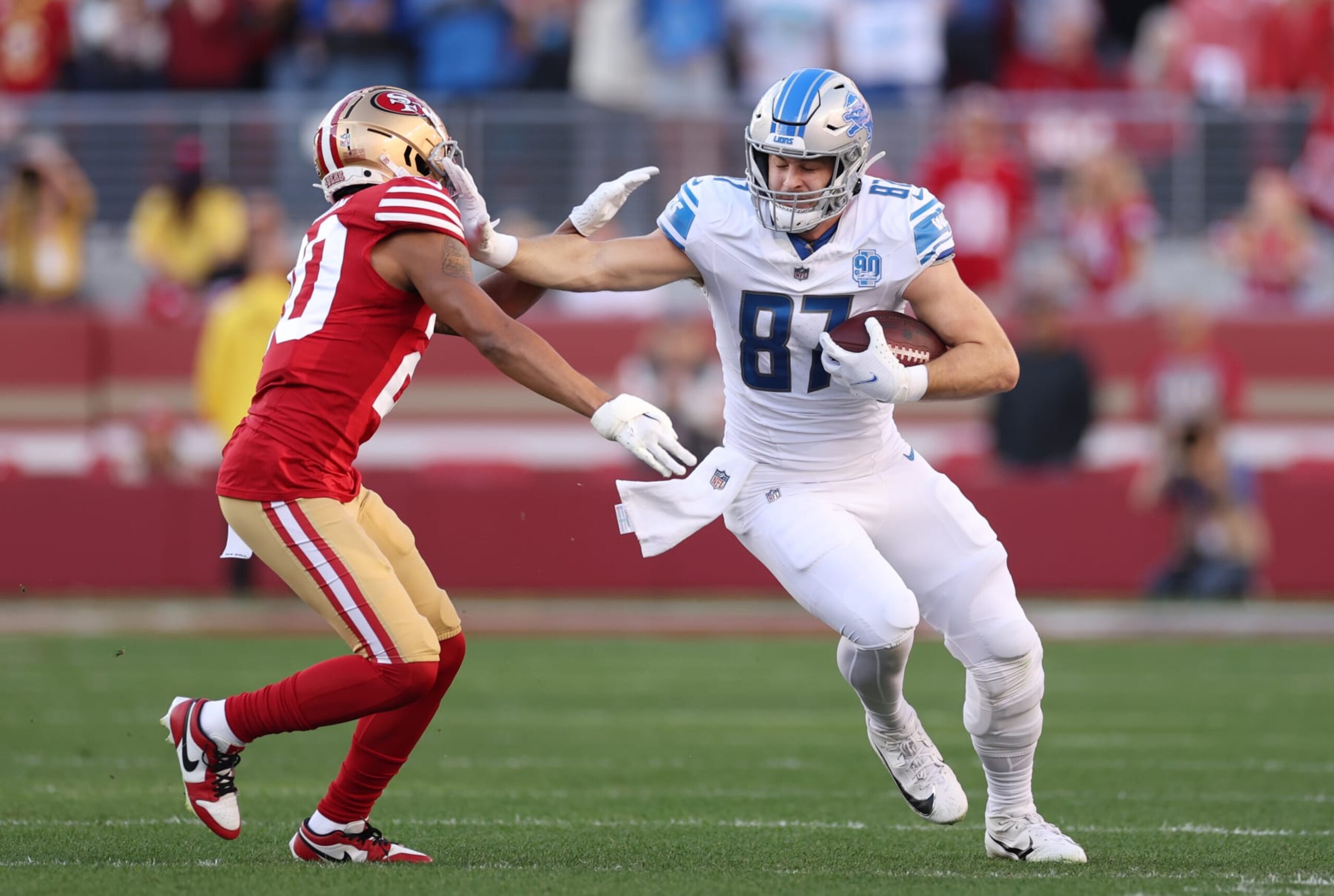 SANTA CLARA, CALIFORNIA - JANUARY 28: Sam LaPorta #87 of the Detroit Lions runs the ball against Ambry Thomas #20 of the San Francisco 49ers during the first quarter in the NFC Championship Game at Levi's Stadium on January 28, 2024 in Santa Clara, California. (Photo by Ezra Shaw/Getty Images)