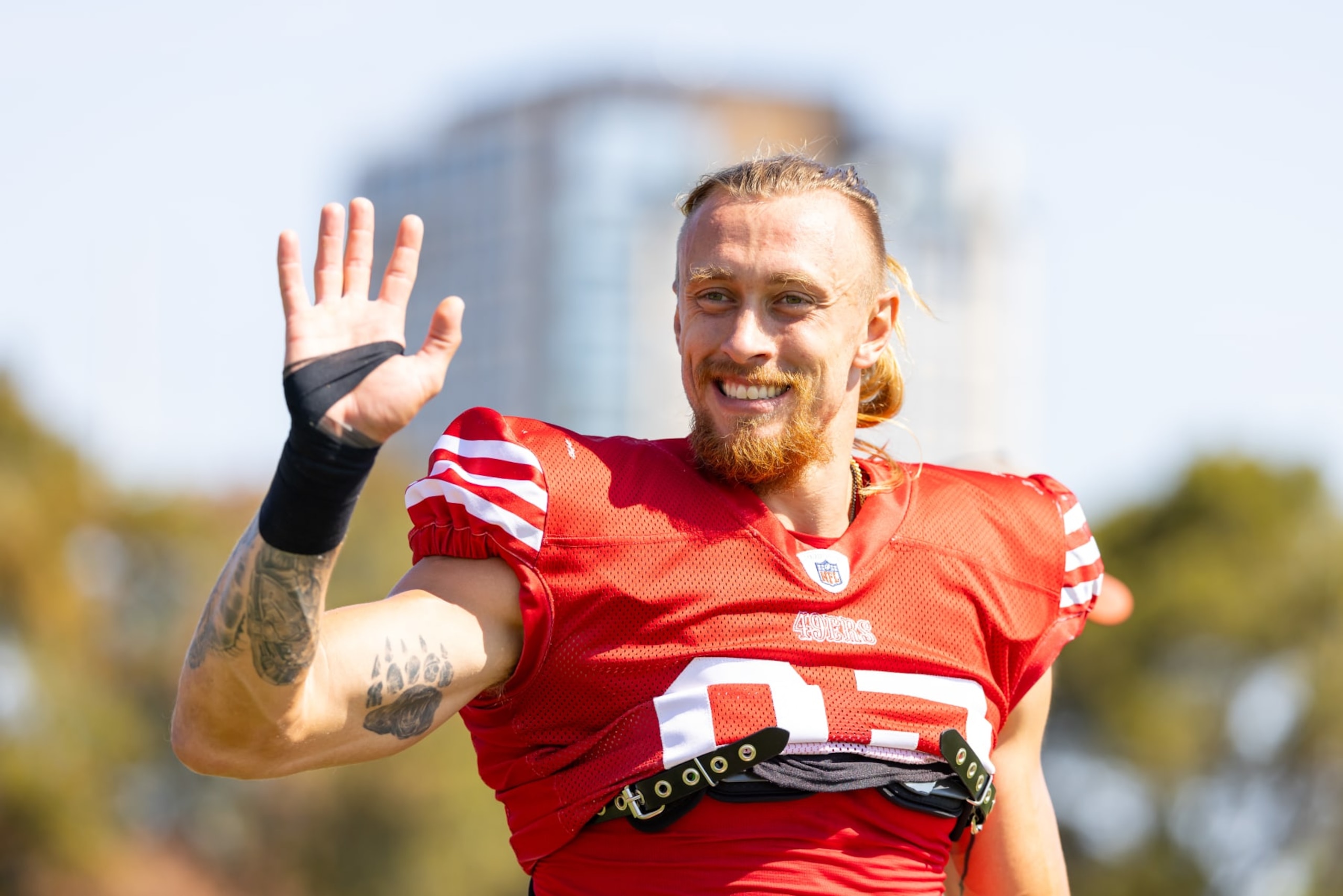 SANTA CLARA, CA - AUGUST 03: San Francisco 49ers tight end George Kittle (85) waves at fans during training camp on August 3, 2024 at SAP Performance Facility in Santa Clara, CA. (Photo by Matthew Huang/Icon Sportswire via Getty Images)