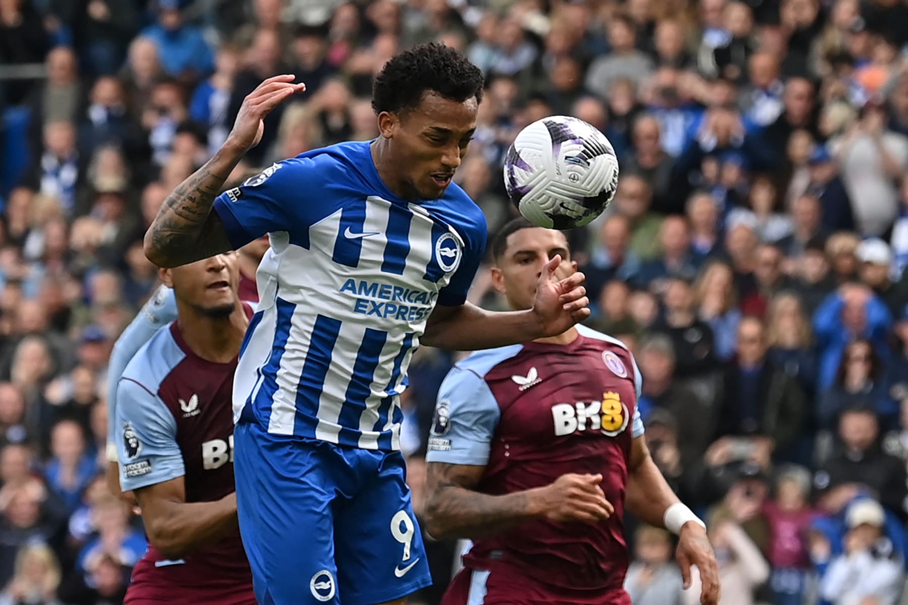 Brighton's Brazilian striker #09 Joao Pedro heads home the rebound after Aston Villa's Swedish goalkeeper #25 Robin Olsen saves his penalty during the English Premier League football match between Brighton and Hove Albion and Aston Villa at the American Express Community Stadium in Brighton, southern England on May 5, 2024. (Photo by Glyn KIRK / AFP) / RESTRICTED TO EDITORIAL USE. No use with unauthorized audio, video, data, fixture lists, club/league logos or 'live' services. Online in-match use limited to 120 images. An additional 40 images may be used in extra time. No video emulation. Social media in-match use limited to 120 images. An additional 40 images may be used in extra time. No use in betting publications, games or single club/league/player publications. / (Photo by GLYN KIRK/AFP via Getty Images)