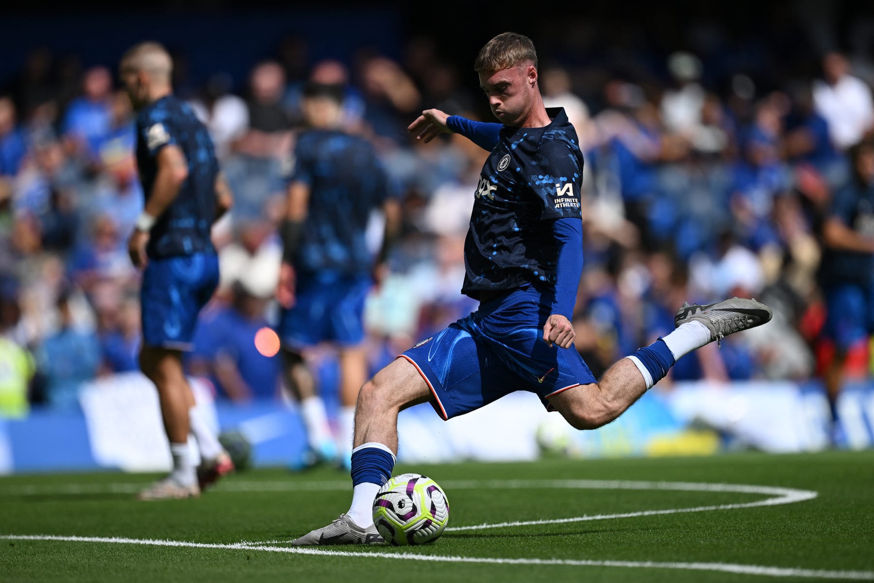 Chelsea's English midfielder #20 Cole Palmer warms up ahead of the pre-season friendly football match between Chelsea and Inter Milan at the Stamford Bridge stadium in London on August 11, 2024. (Photo by JUSTIN TALLIS / AFP) (Photo by JUSTIN TALLIS/AFP via Getty Images)
