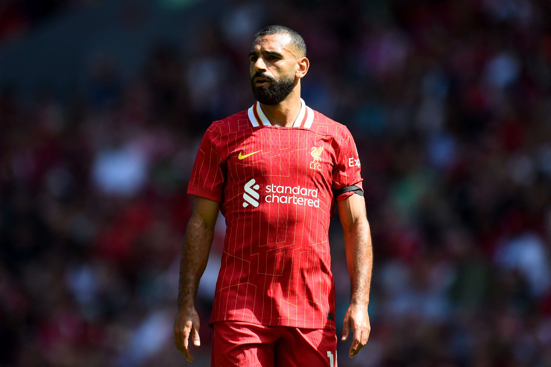 Liverpool's Egyptian striker #11 Mohamed Salah reacts during the pre-season friendly football match between Liverpool and Sevilla at Anfield stadium in Liverpool, northwest England on August 11, 2024. (Photo by Peter POWELL / AFP) (Photo by PETER POWELL/AFP via Getty Images)
