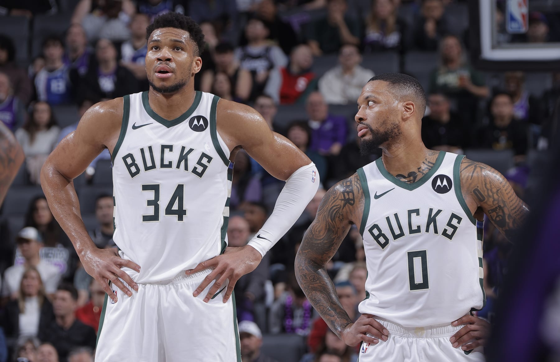 SACRAMENTO, CA - MARCH 12: Giannis Antetokounmpo #34 and Damian Lillard #0 of the Milwaukee Bucks talk during the game against the Sacramento Kings on March 12, 2024 at Golden 1 Center in Sacramento, California. NOTE TO USER: User expressly acknowledges and agrees that, by downloading and or using this photograph, User is consenting to the terms and conditions of the Getty Images Agreement. Mandatory Copyright Notice: Copyright 2024 NBAE (Photo by Rocky Widner/NBAE via Getty Images)
