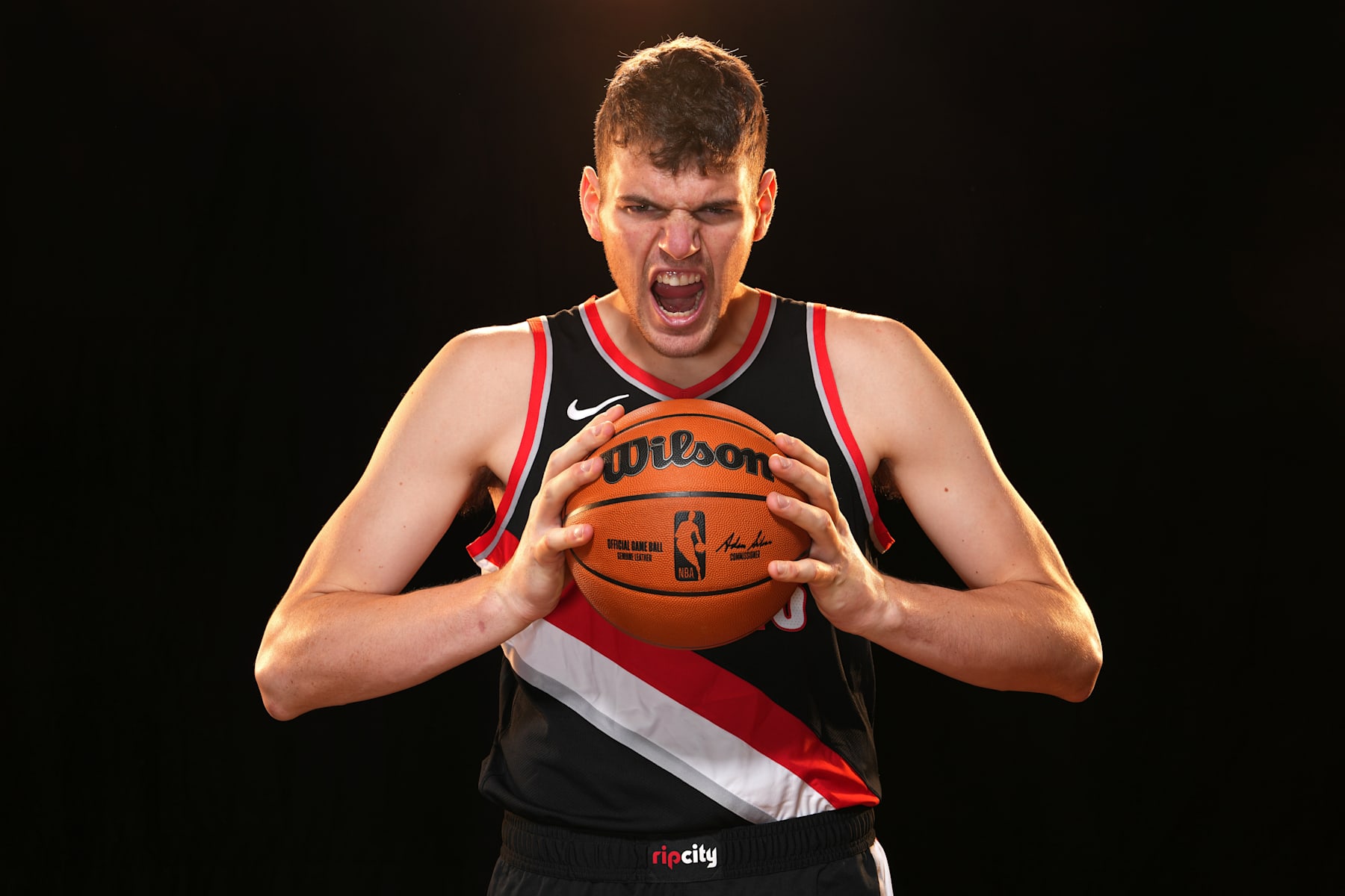 LAS VEGAS, NV - JULY 17: Donovan Clingan #23 of the Portland Trail Blazers poses for a portrait during the 2024 NBA Rookie Photo Shoot on July 17, 2024 at the University of Nevada, Las Vegas campus in Las Vegas, Nevada. NOTE TO USER: User expressly acknowledges and agrees that, by downloading and/or using this Photograph, user is consenting to the terms and conditions of the Getty Images License Agreement. Mandatory Copyright Notice: Copyright 2024 NBAE (Photo by Jeff Bottari/NBAE via Getty Images)