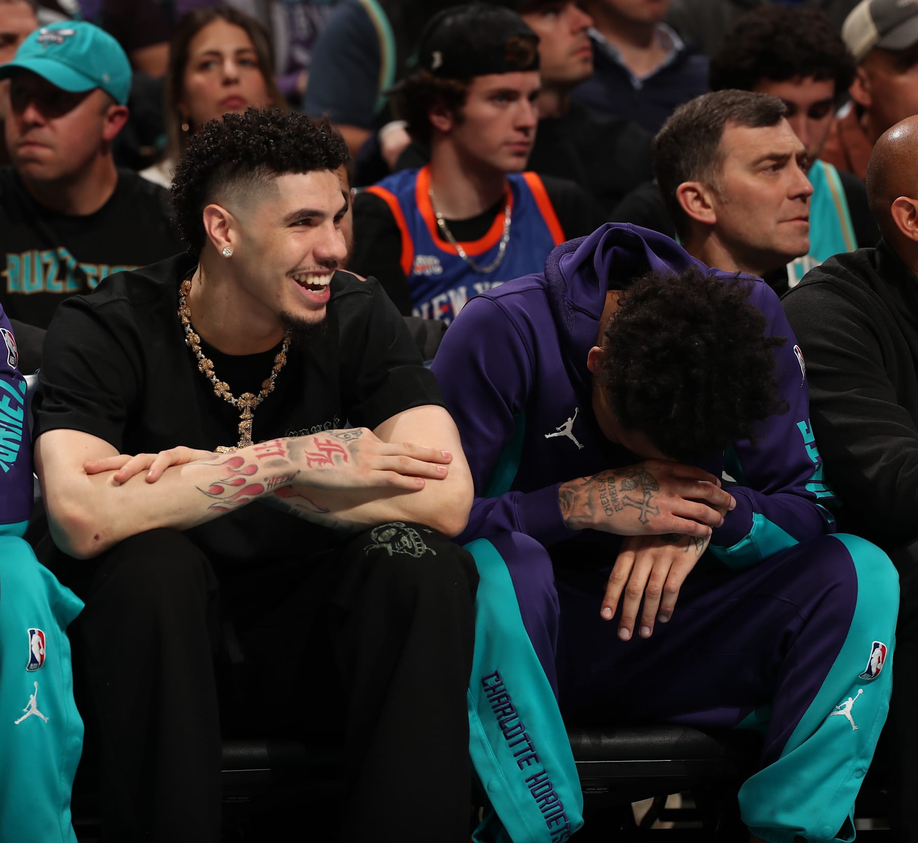 CHARLOTTE, NC - JANUARY 29: LaMelo Ball #1 of the Charlotte Hornets and James Bouknight #2 laugh on the bench during the game against the New York Knicks on January 29, 2024 at Spectrum Center in Charlotte, North Carolina. NOTE TO USER: User expressly acknowledges and agrees that, by downloading and or using this photograph, User is consenting to the terms and conditions of the Getty Images License Agreement. Mandatory Copyright Notice: Copyright 2024 NBAE (Photo by Kent Smith/NBAE via Getty Images)