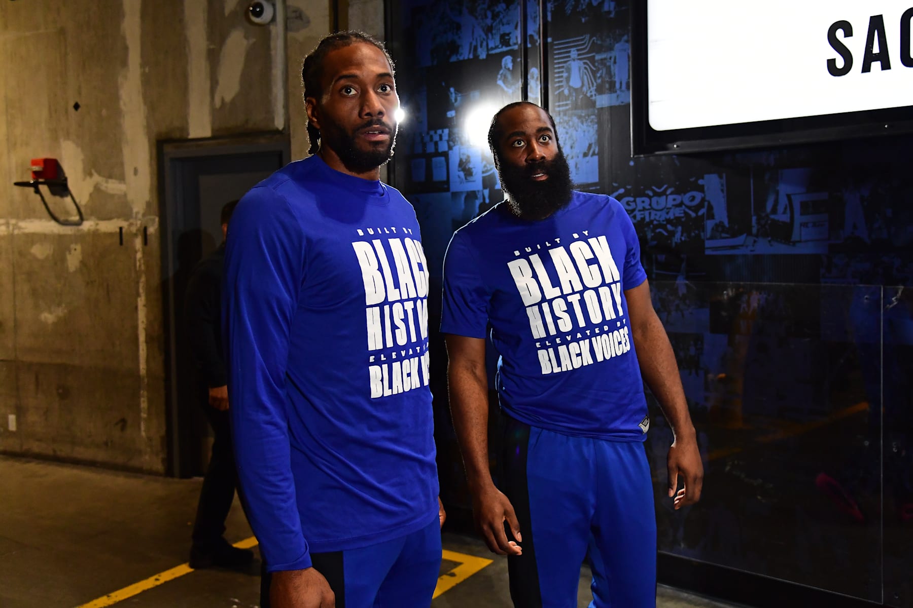 LOS ANGELES, CA - FEBRUARY 25:  Kawhi Leonard #2 and James Harden #1 of the LA Clippers looks on during the game against the Sacramento Kings on February 25, 2024 at Crypto.Com Arena in Los Angeles, California. NOTE TO USER: User expressly acknowledges and agrees that, by downloading and/or using this Photograph, user is consenting to the terms and conditions of the Getty Images License Agreement. Mandatory Copyright Notice: Copyright 2024 NBAE (Photo by Adam Pantozzi/NBAE via Getty Images)
