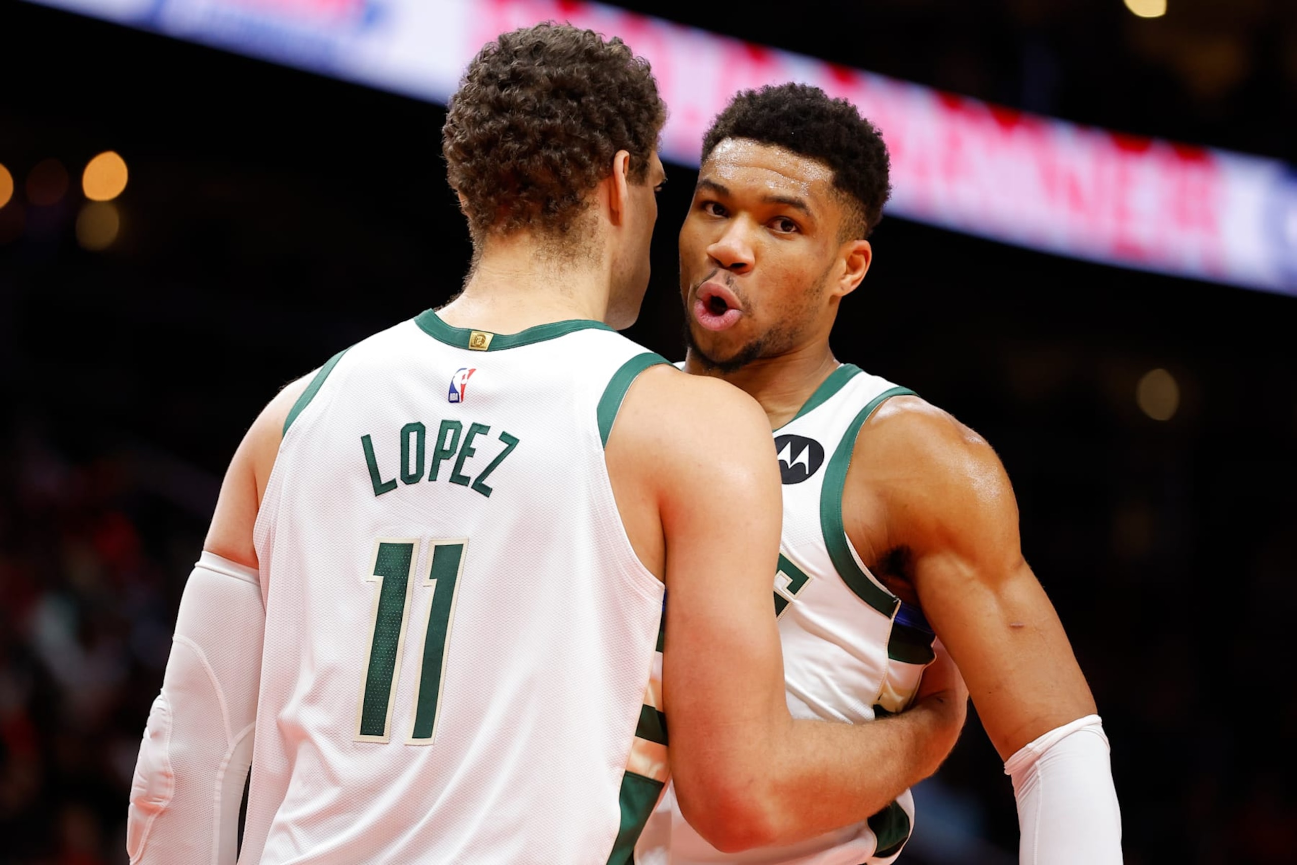 ATLANTA, GA - JANUARY 11: Brook Lopez #11 reacts with Giannis Antetokounmpo #34 of the Milwaukee Bucks during the first half against the Atlanta Hawks at State Farm Arena on January 11, 2023 in Atlanta, Georgia.  NOTE TO USER: User expressly acknowledges and agrees that, by downloading and or using this photograph, User is consenting to the terms and conditions of the Getty Images License Agreement. (Photo by Todd Kirkland/Getty Images)