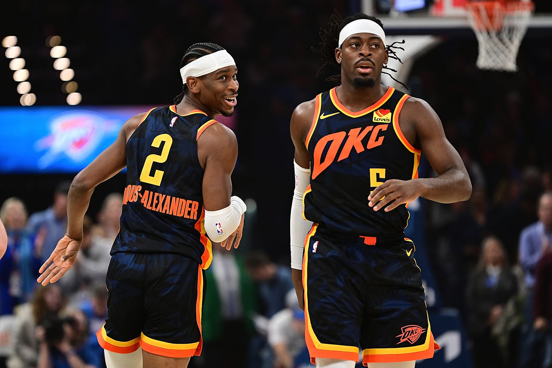 OKLAHOMA CITY, OKLAHOMA - FEBRUARY 11: Shai Gilgeous-Alexander #2 and Luguentz Dort #5 of the Oklahoma City Thunder run down the floor during the first half against the Sacramento Kings at Paycom Center on February 11, 2024 in Oklahoma City, Oklahoma. NOTE TO USER: User expressly acknowledges and agrees that, by downloading and or using this Photograph, user is consenting to the terms and conditions of the Getty Images License Agreement. (Photo by Joshua Gateley/Getty Images)