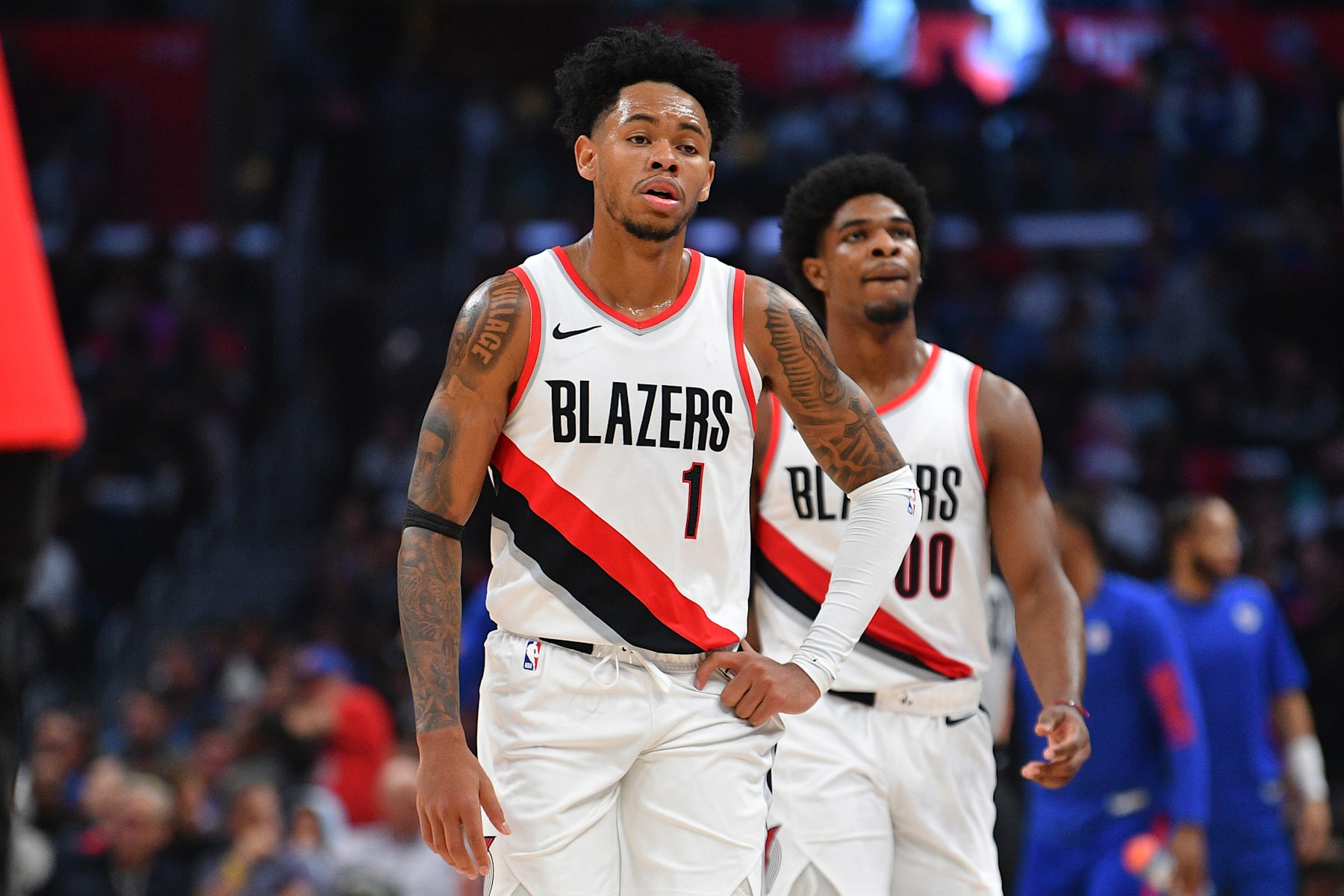 LOS ANGELES, CA - OCTOBER 25: Portland Trail Blazers guard Anfernee Simons (1) and Portland Trail Blazers guard Scoot Henderson (00) look on during a NBA  game between the Denver Nuggets and the Portland Trail Blazers on October 25, 2023 at Crypto.com Arena in Los Angeles, CA. (Photo by Brian Rothmuller/Icon Sportswire via Getty Images)