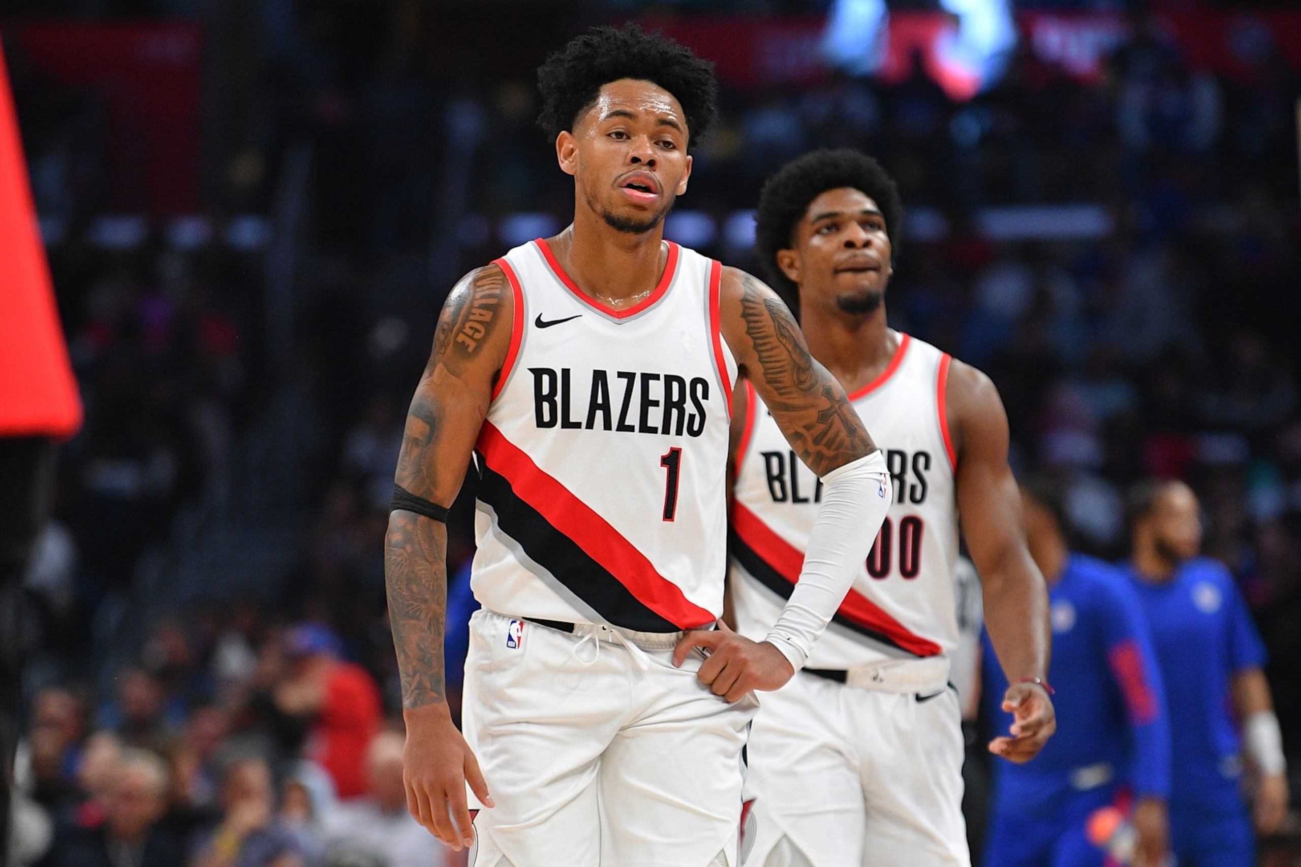 LOS ANGELES, CA - OCTOBER 25: Portland Trail Blazers guard Anfernee Simons (1) and Portland Trail Blazers guard Scoot Henderson (00) look on during a NBA  game between the Denver Nuggets and the Portland Trail Blazers on October 25, 2023 at Crypto.com Arena in Los Angeles, CA. (Photo by Brian Rothmuller/Icon Sportswire via Getty Images)