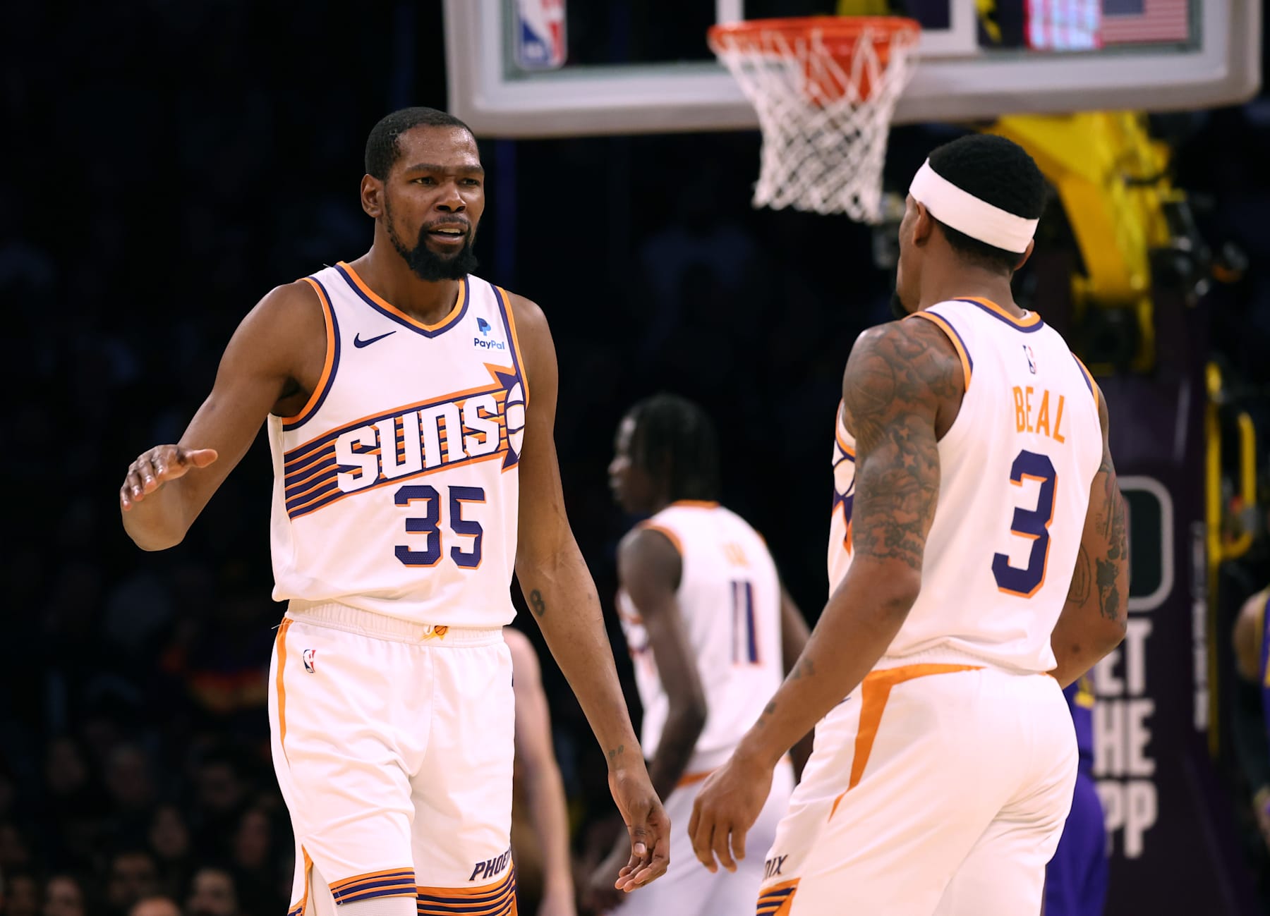 LOS ANGELES, CALIFORNIA - JANUARY 11: Kevin Durant #35 and Bradley Beal #3 of the Phoenix Suns celebrate a score during a 127-109 Suns win over the Los Angeles Lakers at Crypto.com Arena on January 11, 2024 in Los Angeles, California. User is consenting to the terms and conditions of the Getty Images License Agreement.  (Photo by Harry How/Getty Images)