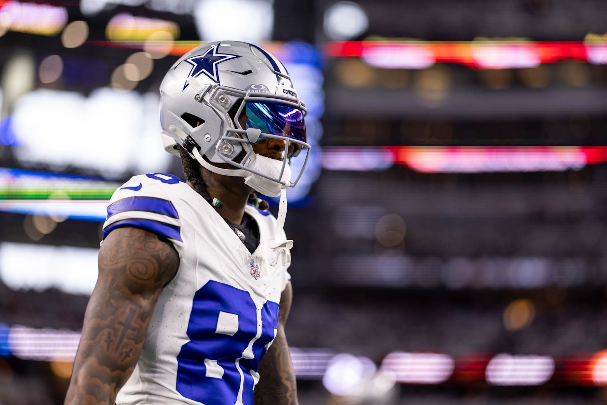 ARLINGTON, TEXAS - JANUARY 14: CeeDee Lamb #88 of the Dallas Cowboys looks on as he warms up prior to an NFL wild-card playoff football game between the Dallas Cowboys and the Green Bay Packers at AT&T Stadium on January 14, 2024 in Arlington, Texas. (Photo by Michael Owens/Getty Images)