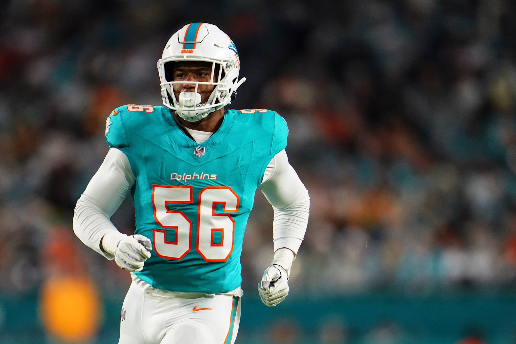 MIAMI GARDENS, FL - DECEMBER 11: Quinton Bell #56 of the Miami Dolphins runs down the field during an NFL football game against the Tennessee Titans at Hard Rock Stadium on December 11, 2023 in Miami Gardens, Florida. (Photo by Cooper Neill/Getty Images)