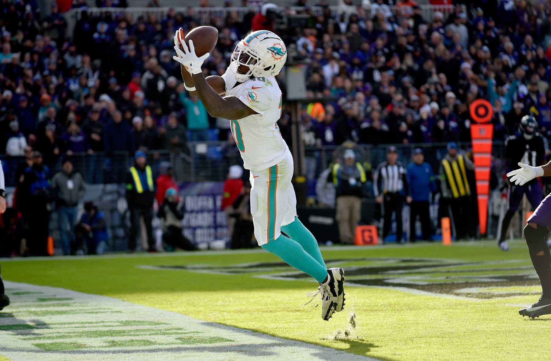 BALTIMORE, MD - DECEMBER 31: Miami Dolphins wide receiver Tyreek Hill (10) can't bring down a catch in the back of the end zone during the Miami Dolphins versus Baltimore Ravens NFL game at M&T Bank Stadium on December 31, 2023 in Baltimore, MD. (Photo by Randy Litzinger/Icon Sportswire via Getty Images)