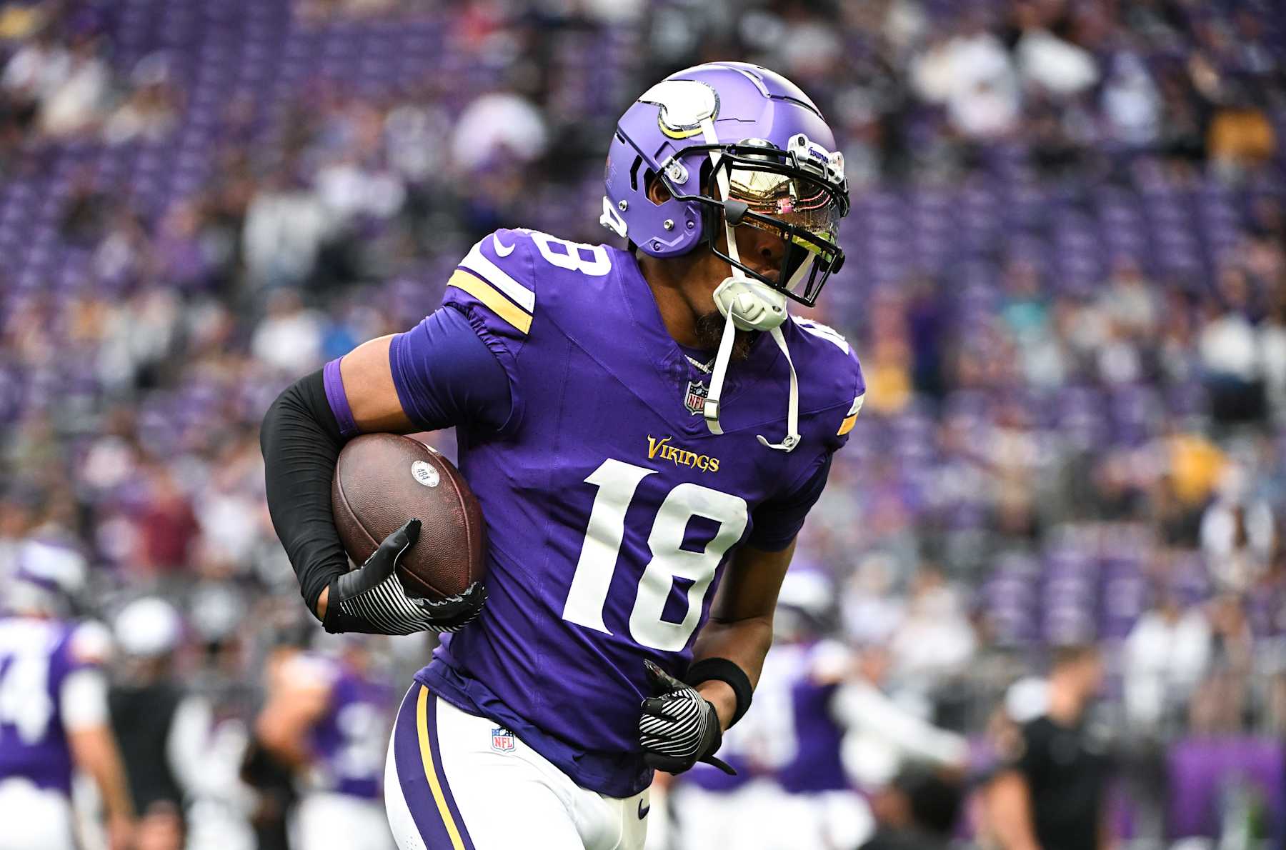 MINNEAPOLIS, MINNESOTA - AUGUST 10: Justin Jefferson #18 of the Minnesota Vikings warms up before the preseason game against the Las Vegas Raiders at U.S. Bank Stadium on August 10, 2024 in Minneapolis, Minnesota. (Photo by Stephen Maturen/Getty Images)