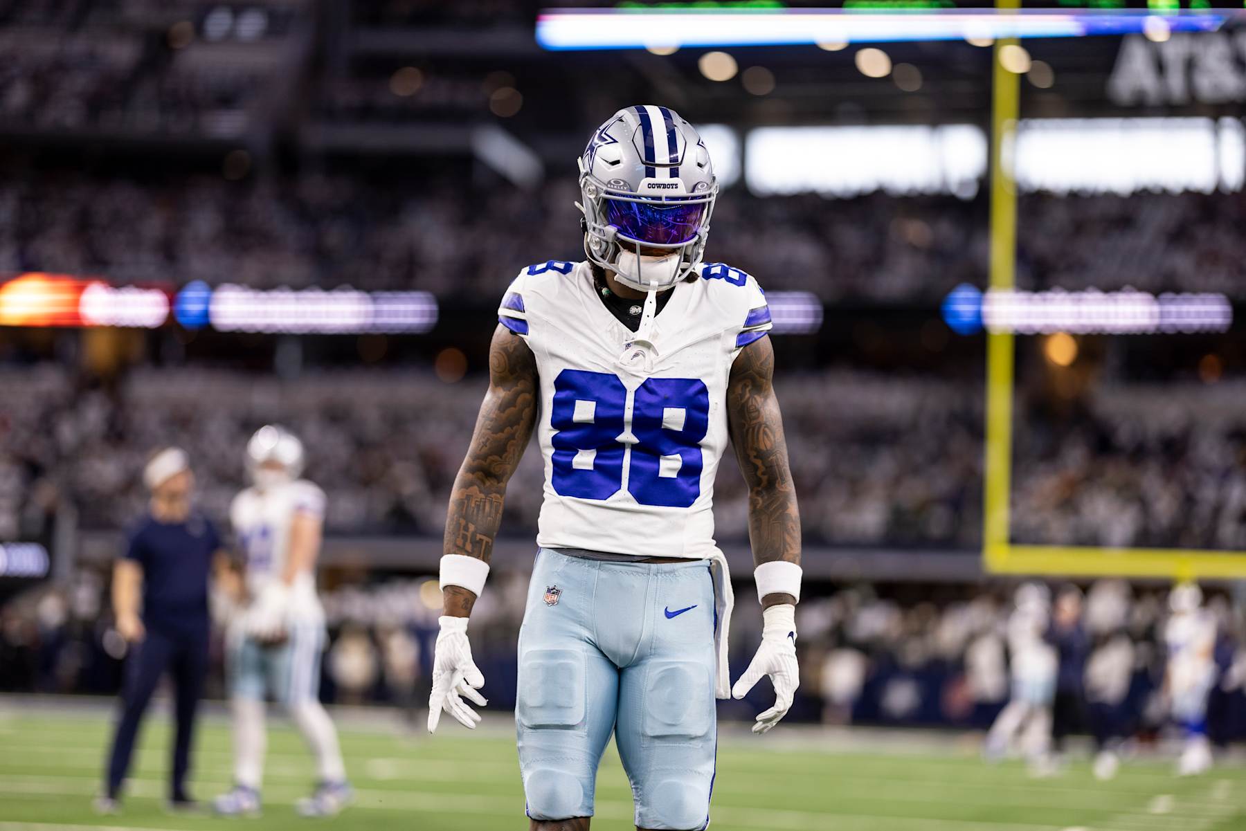 ARLINGTON, TEXAS - JANUARY 14: CeeDee Lamb #88 of the Dallas Cowboys looks on as he warms up prior to an NFL wild-card playoff football game between the Dallas Cowboys and the Green Bay Packers at AT&T Stadium on January 14, 2024 in Arlington, Texas. (Photo by Michael Owens/Getty Images)