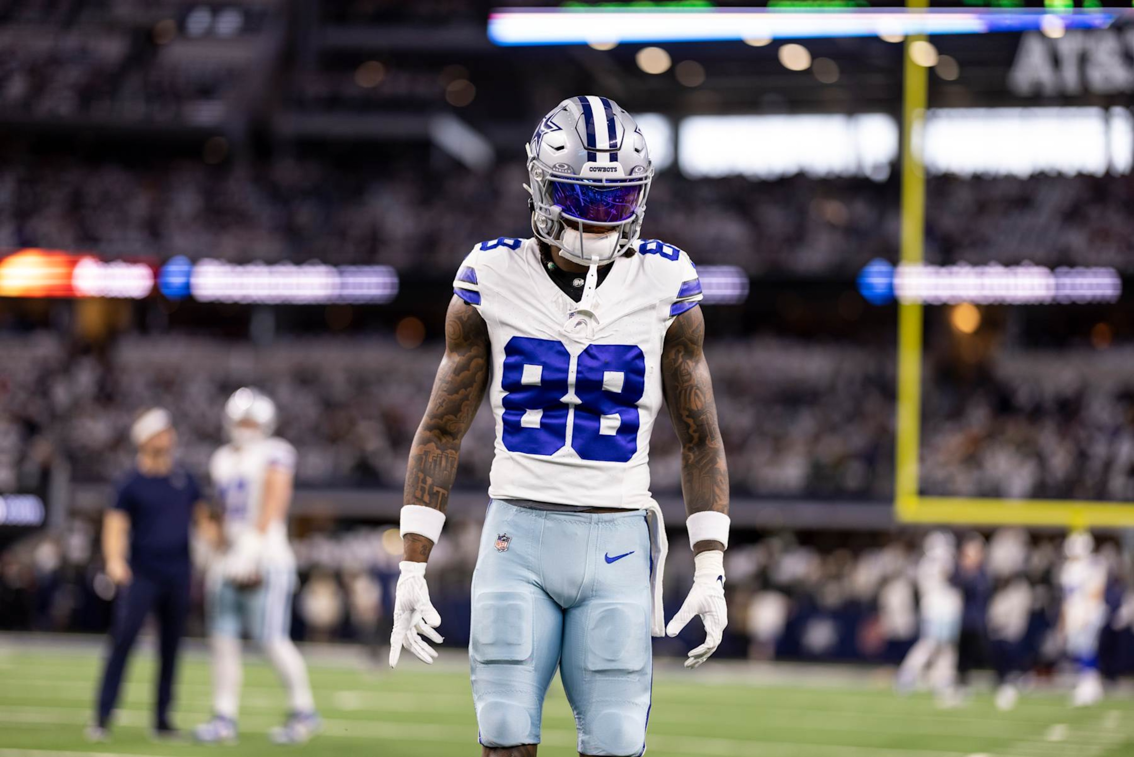 ARLINGTON, TEXAS - JANUARY 14: CeeDee Lamb #88 of the Dallas Cowboys looks on as he warms up prior to an NFL wild-card playoff football game between the Dallas Cowboys and the Green Bay Packers at AT&T Stadium on January 14, 2024 in Arlington, Texas. (Photo by Michael Owens/Getty Images)
