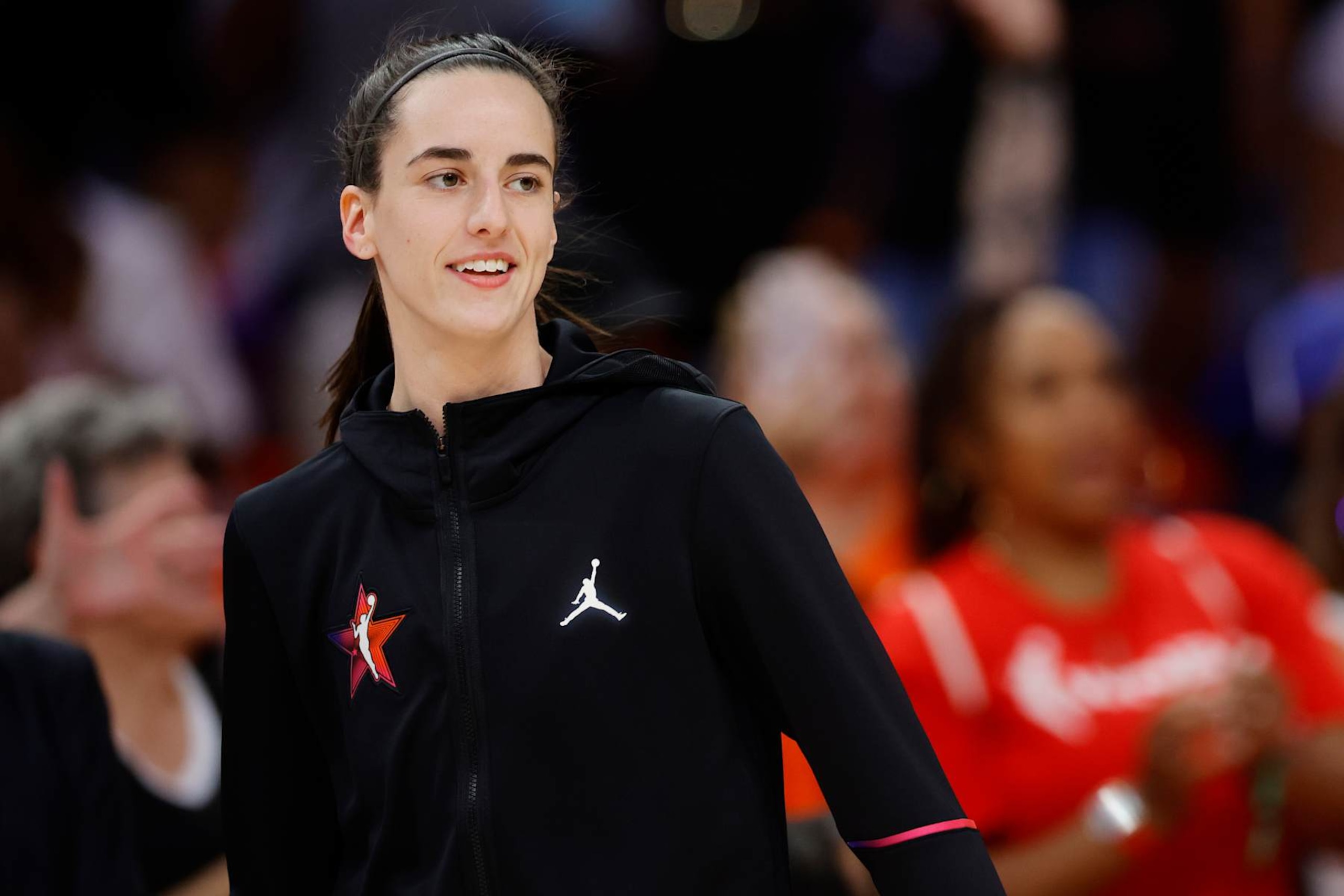 PHOENIX, ARIZONA - JULY 20: Caitlin Clark #22 of Team WNBA looks on before the 2024 WNBA All-Star game against the USA Basketball Women's National Team at Footprint Center on July 20, 2024 in Phoenix, Arizona. NOTE TO USER: User expressly acknowledges and agrees that, by downloading and or using this photograph, User is consenting to the terms and conditions of the Getty Images License Agreement. (Photo by Alex Slitz/Getty Images)