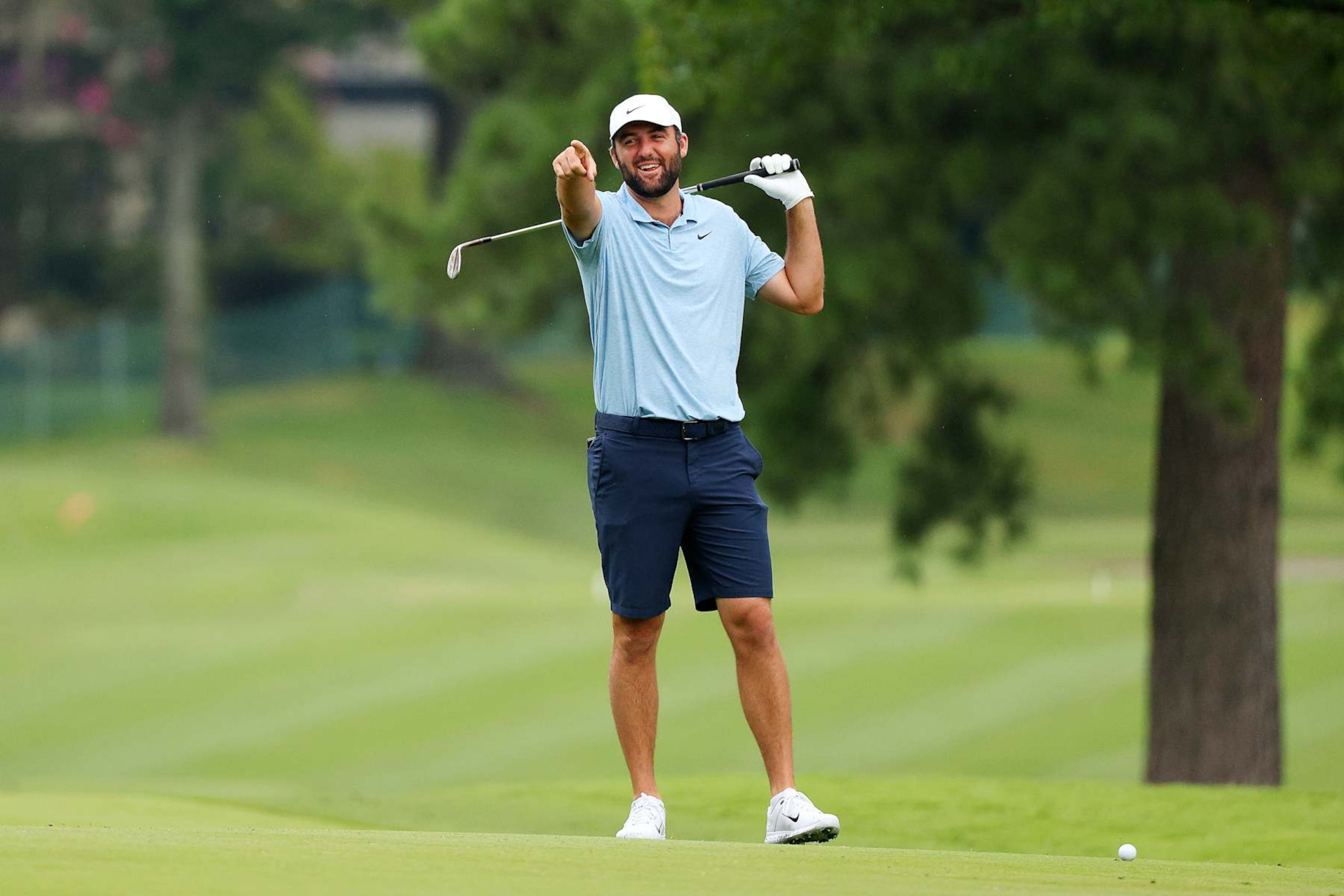 MEMPHIS, TENNESSEE - AUGUST 14: Scottie Scheffler laughs with amateur players on the first hole during the pro-am prior to the FedEx St. Jude Championship at TPC Southwind on August 14, 2024 in Memphis, Tennessee. (Photo by Mike Mulholland/Getty Images) MEMPHIS, TENNESSEE - AUGUST 14: Scottie Scheffler laughs with amateur players on the first hole during the pro-am prior to the FedEx St. Jude Championship at TPC Southwind on August 14, 2024 in Memphis, Tennessee. (Photo by Mike Mulholland/Getty Images)
