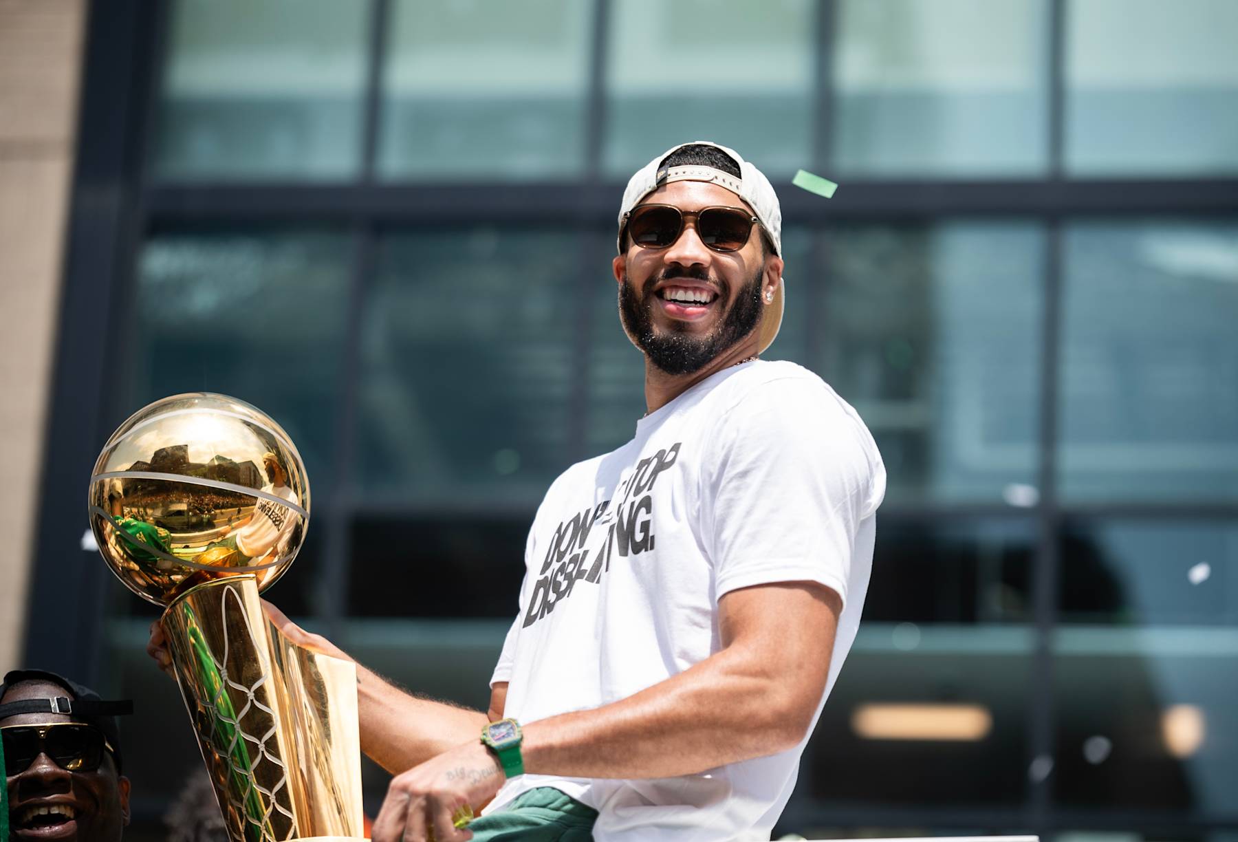 BOSTON, MA - JUNE 21: Jayson Tatum #0 of the Boston Celtics celebrates with the Larry O'Brien Trophy during the 2024 Boston Celtics championship parade on June 21, 2024 in Boston, Massachusetts. NOTE TO USER: User expressly acknowledges and agrees that, by downloading and or using this photograph, User is consenting to the terms and conditions of the Getty Images License Agreement. Mandatory Copyright Notice: Copyright 2024 NBAE  (Photo by China Wong/NBAE via Getty Images)