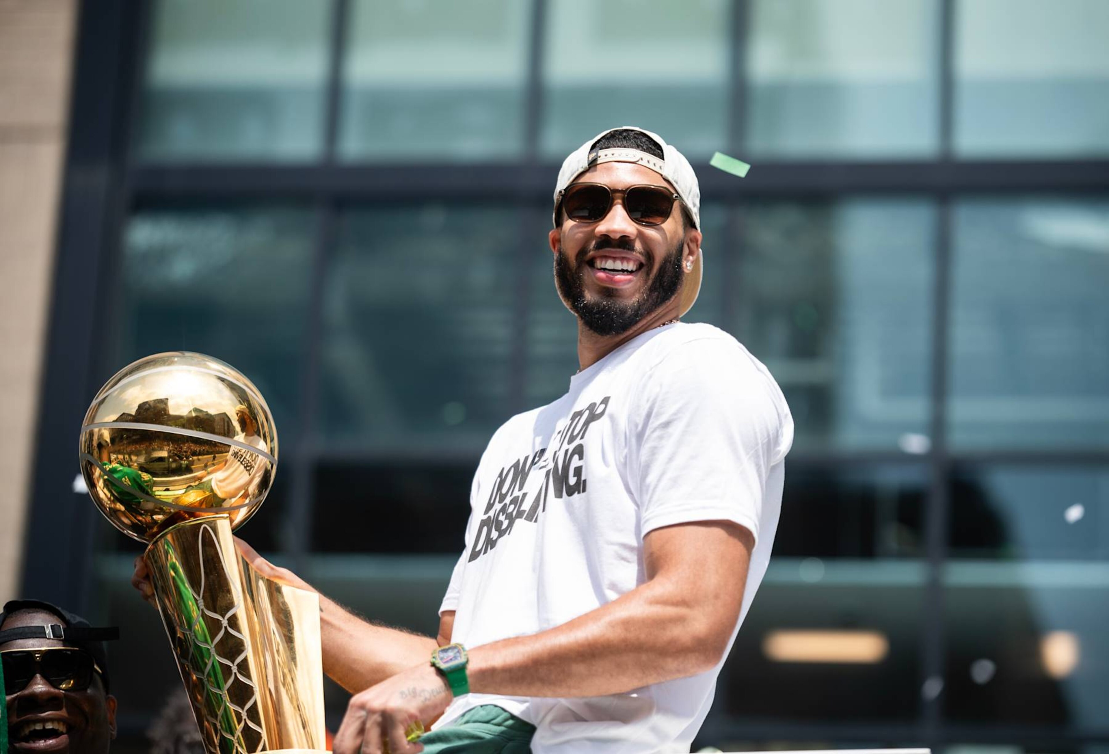 BOSTON, MA - JUNE 21: Jayson Tatum #0 of the Boston Celtics celebrates with the Larry O'Brien Trophy during the 2024 Boston Celtics championship parade on June 21, 2024 in Boston, Massachusetts. NOTE TO USER: User expressly acknowledges and agrees that, by downloading and or using this photograph, User is consenting to the terms and conditions of the Getty Images License Agreement. Mandatory Copyright Notice: Copyright 2024 NBAE (Photo by China Wong/NBAE via Getty Images) BOSTON, MA - JUNE 21: Jayson Tatum #0 of the Boston Celtics celebrates with the Larry O'Brien Trophy during the 2024 Boston Celtics championship parade on June 21, 2024 in Boston, Massachusetts. NOTE TO USER: User expressly acknowledges and agrees that, by downloading and or using this photograph, User is consenting to the terms and conditions of the Getty Images License Agreement. Mandatory Copyright Notice: Copyright 2024 NBAE (Photo by China Wong/NBAE via Getty Images)