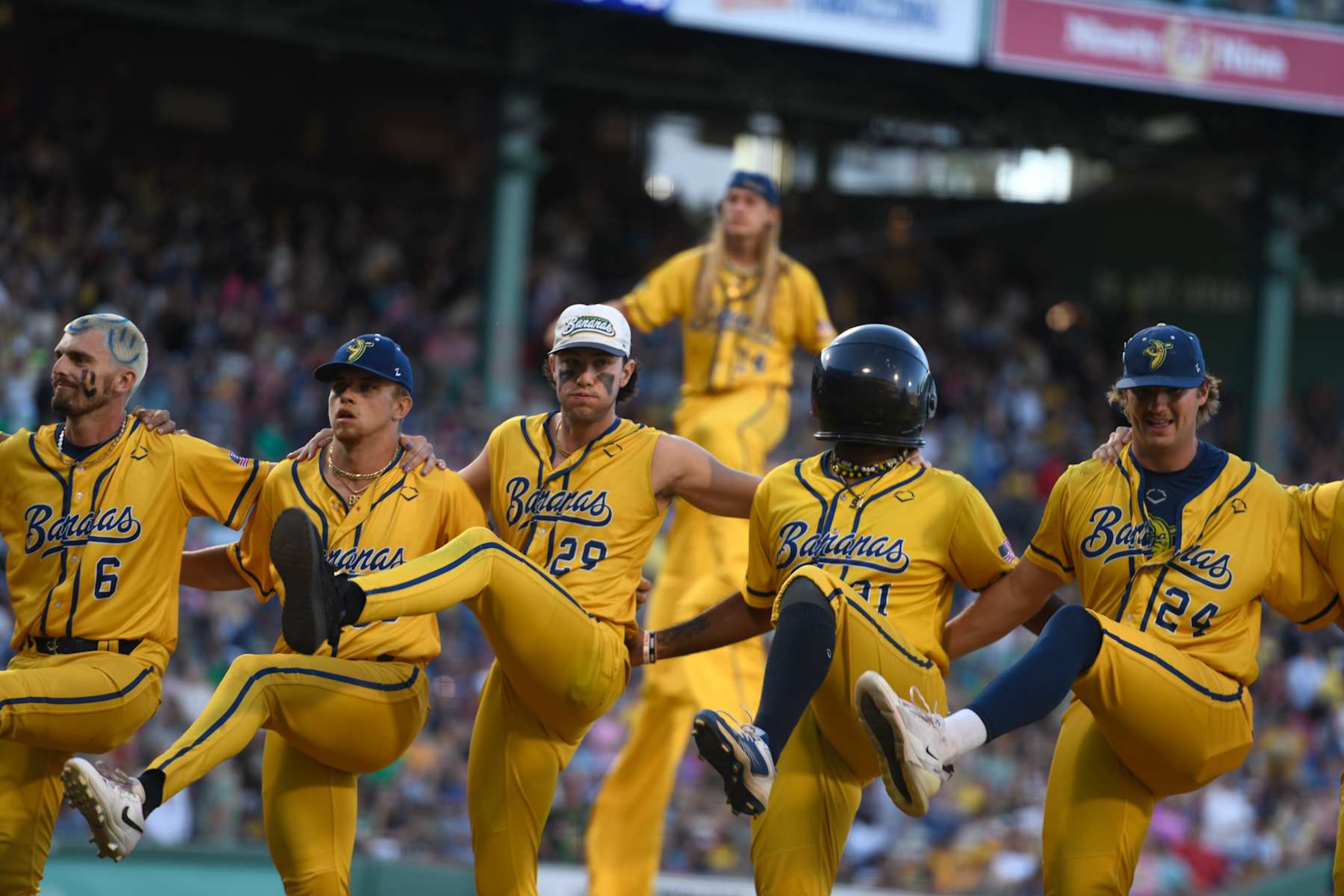 BOSTON, MASSACHUSETTS - JUNE 08: Members of the Savannah Bananas dance before a game against the Party Animals at Fenway Park on June 08, 2024 in Boston, Massachusetts. (Photo by Jaiden Tripi/Getty Images) BOSTON, MASSACHUSETTS - JUNE 08: Members of the Savannah Bananas dance before a game against the Party Animals at Fenway Park on June 08, 2024 in Boston, Massachusetts. (Photo by Jaiden Tripi/Getty Images)