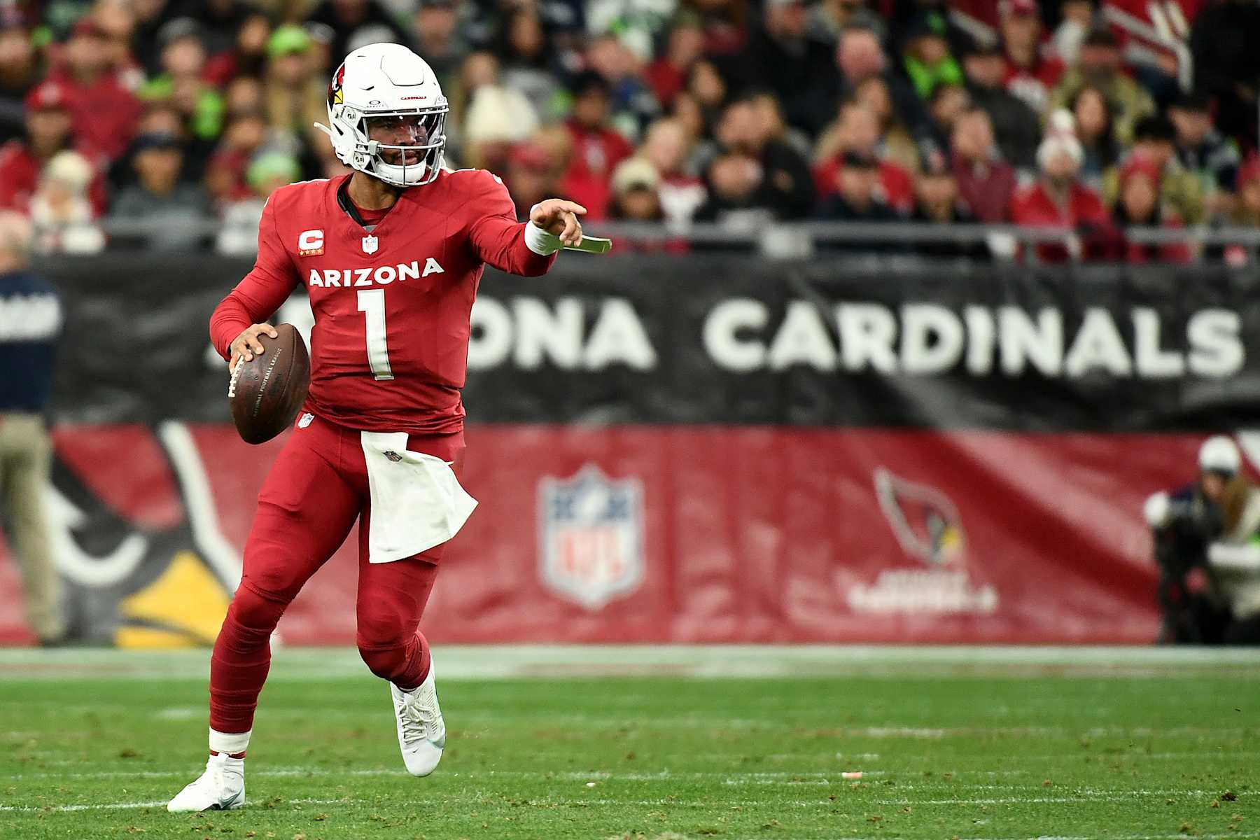 GLENDALE, ARIZONA - JANUARY 07: Kyler Murray #1 of the Arizona Cardinals runs with the ball during the first half against the Seattle Seahawks at State Farm Stadium on January 07, 2024 in Glendale, Arizona. (Photo by Jennifer Stewart/Getty Images)
