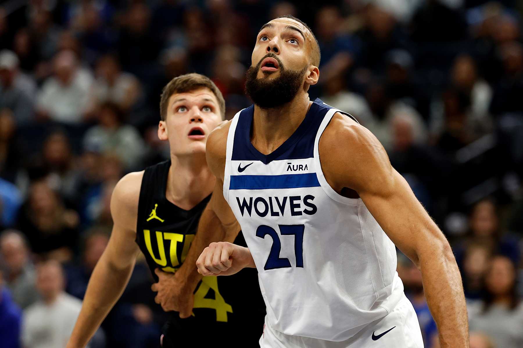 MINNEAPOLIS, MINNESOTA - NOVEMBER 30: Rudy Gobert #27 of the Minnesota Timberwolves and Walker Kessler #24 of the Utah Jazz compete for the rebound in the first quarter at Target Center on November 30, 2023 in Minneapolis, Minnesota. NOTE TO USER: User expressly acknowledges and agrees that, by downloading and or using this photograph, User is consenting to the terms and conditions of the Getty Images License Agreement. (Photo by David Berding/Getty Images)