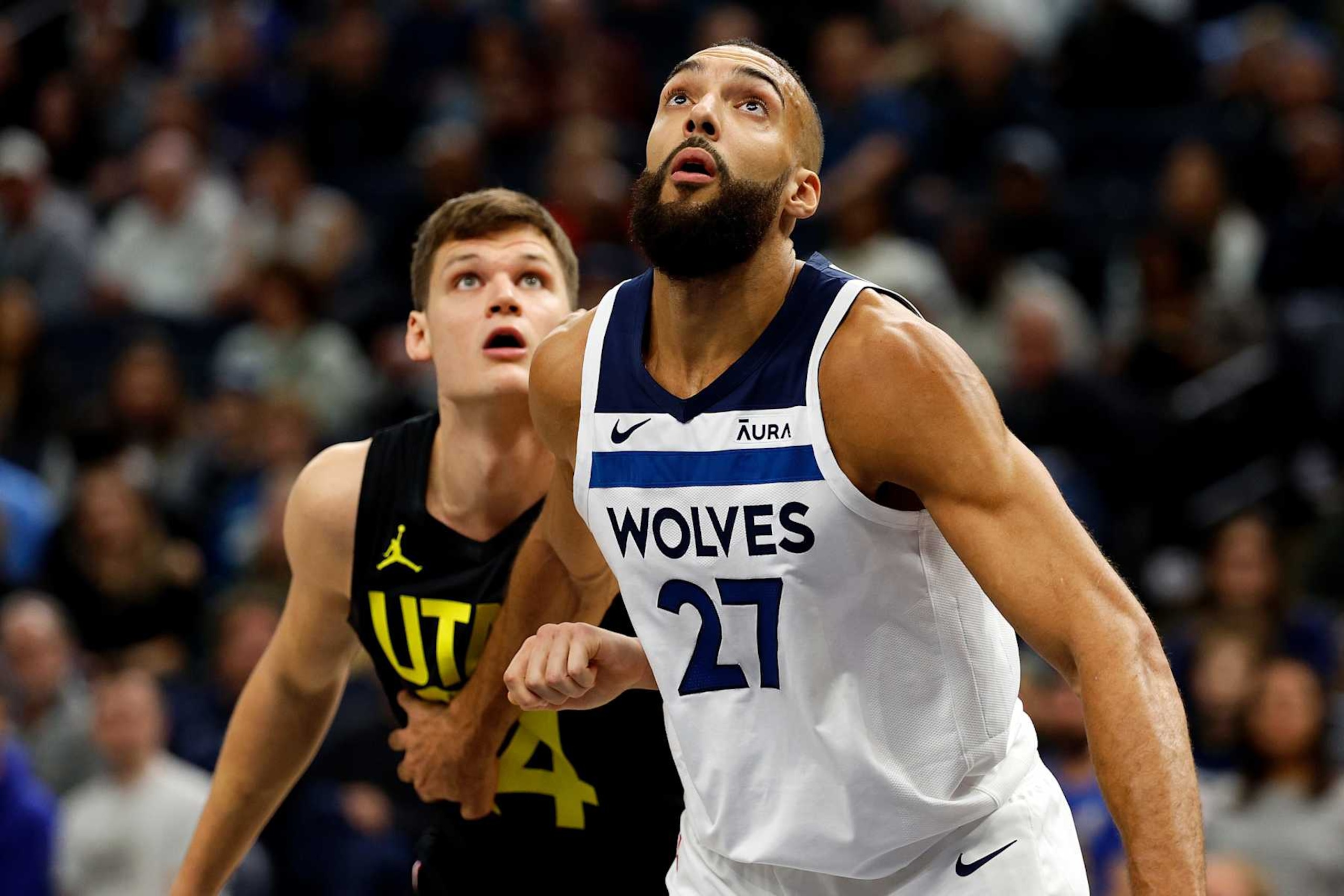 MINNEAPOLIS, MINNESOTA - NOVEMBER 30: Rudy Gobert #27 of the Minnesota Timberwolves and Walker Kessler #24 of the Utah Jazz compete for the rebound in the first quarter at Target Center on November 30, 2023 in Minneapolis, Minnesota. NOTE TO USER: User expressly acknowledges and agrees that, by downloading and or using this photograph, User is consenting to the terms and conditions of the Getty Images License Agreement. (Photo by David Berding/Getty Images)